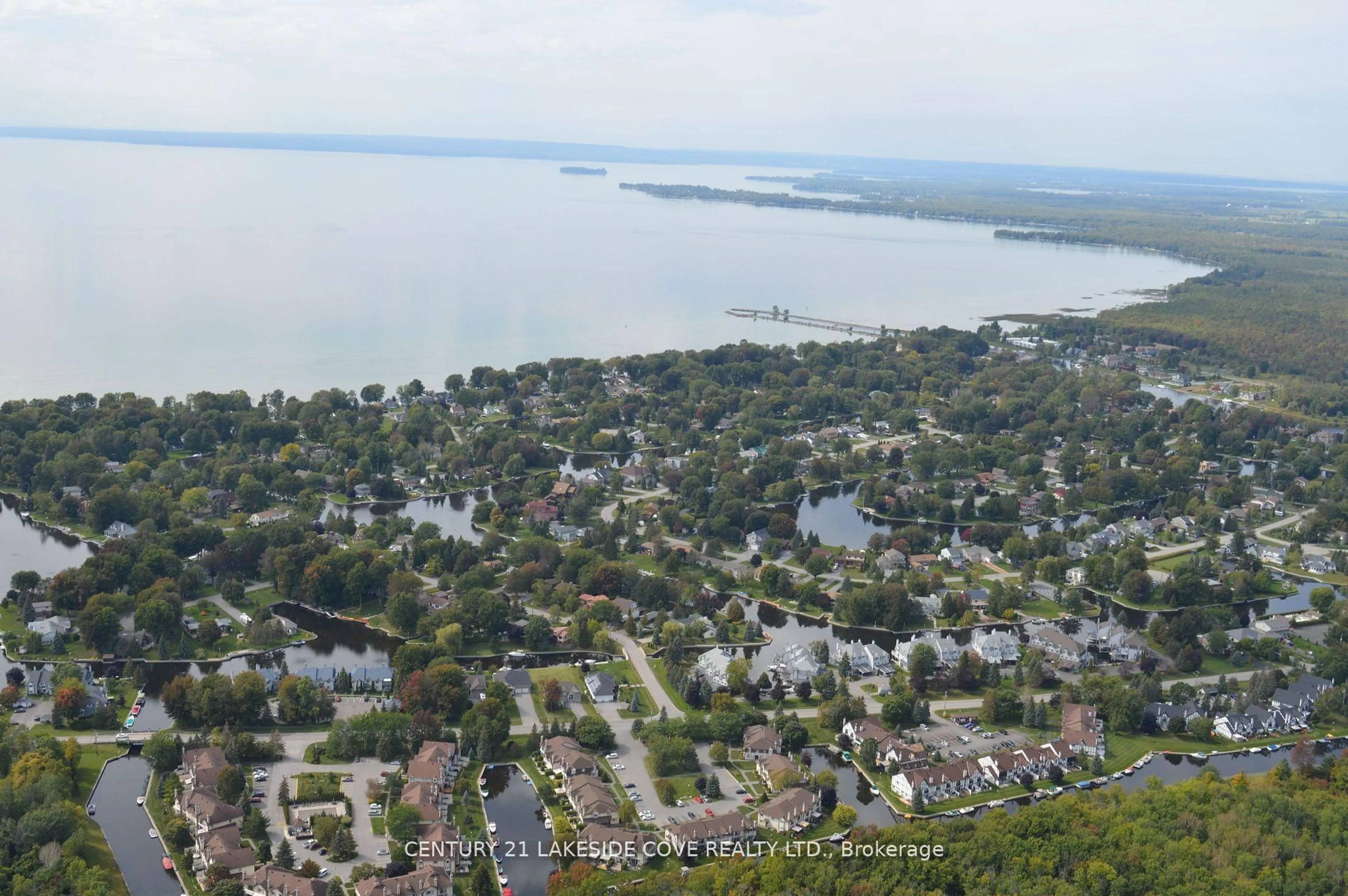 A pic from outside/outdoor area/front of a property/back of a property/a pic from drone, water/lake/river/ocean view for 70 Laguna Pkwy #Unit 6, Ramara Ontario L0K 1B0
