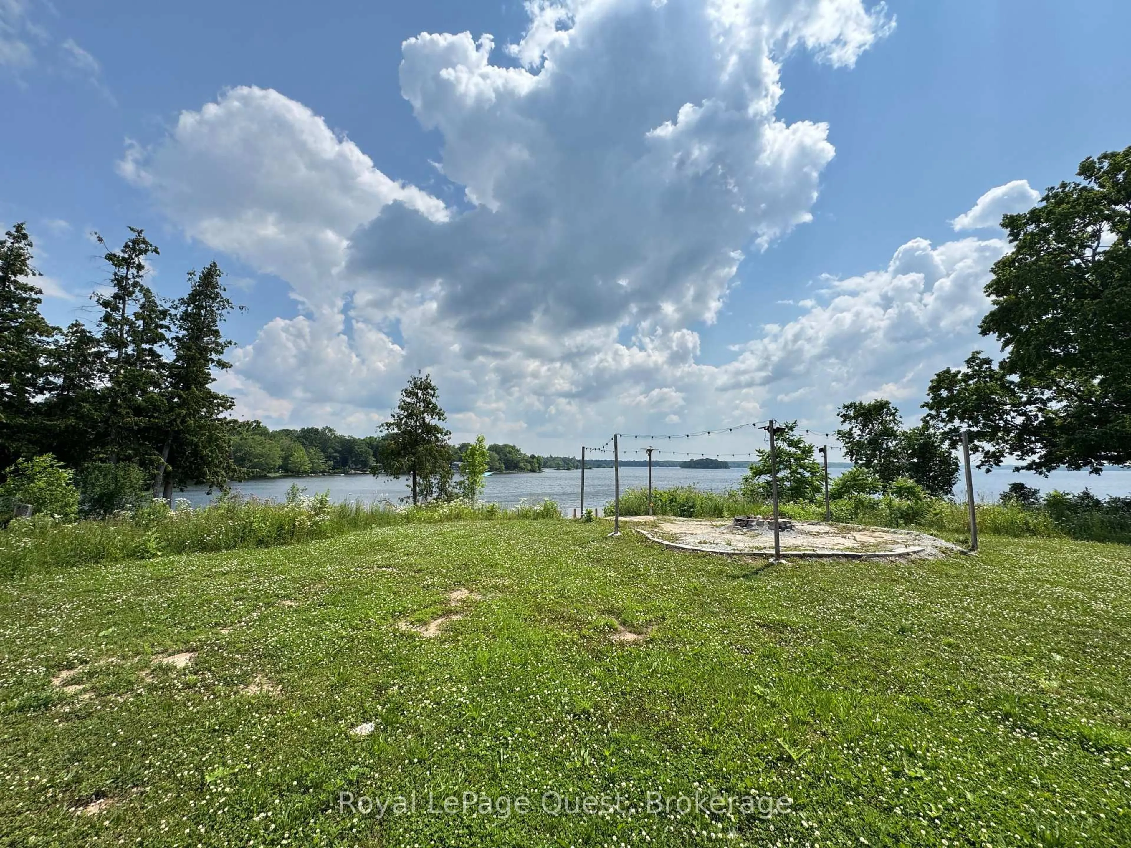 A pic from outside/outdoor area/front of a property/back of a property/a pic from drone, water/lake/river/ocean view for 21 Rosy Beach Crt, Ramara Ontario L3V 8L2