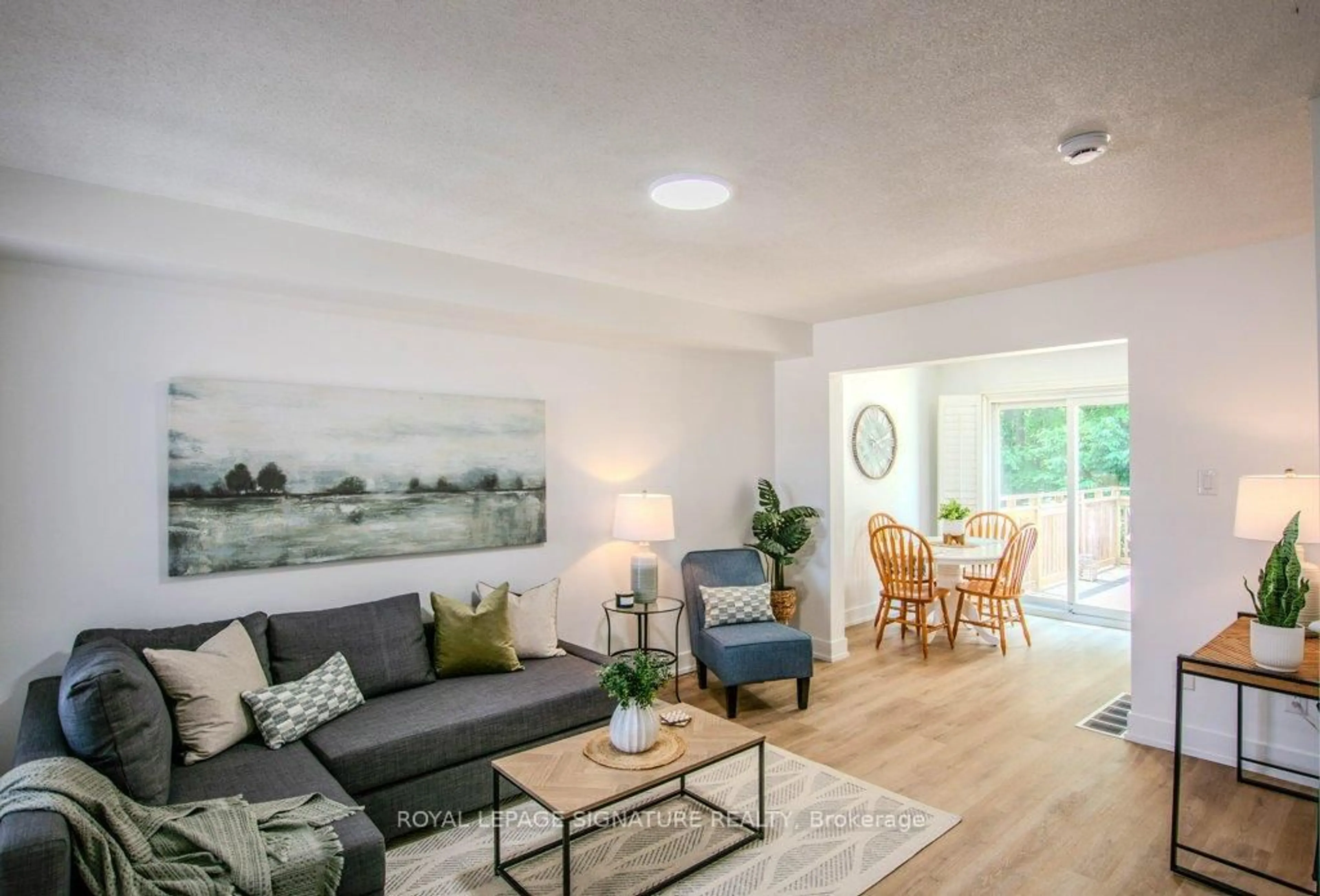 Living room with furniture, wood/laminate floor for 108 Hawthorne Cres, Barrie Ontario L4N 9Y9