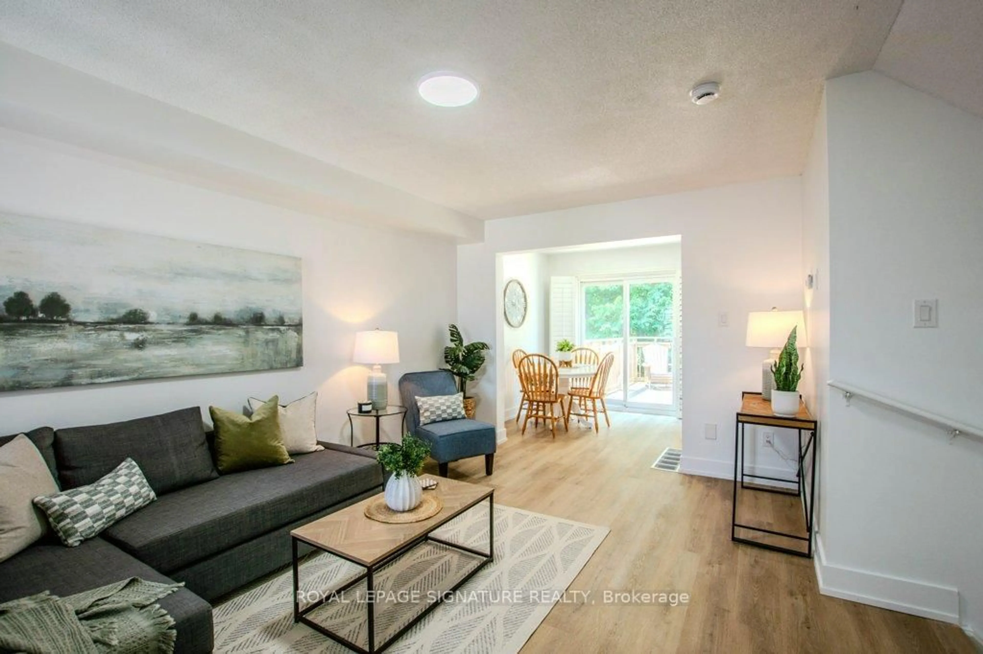 Living room with furniture, wood/laminate floor for 108 Hawthorne Cres, Barrie Ontario L4N 9Y9