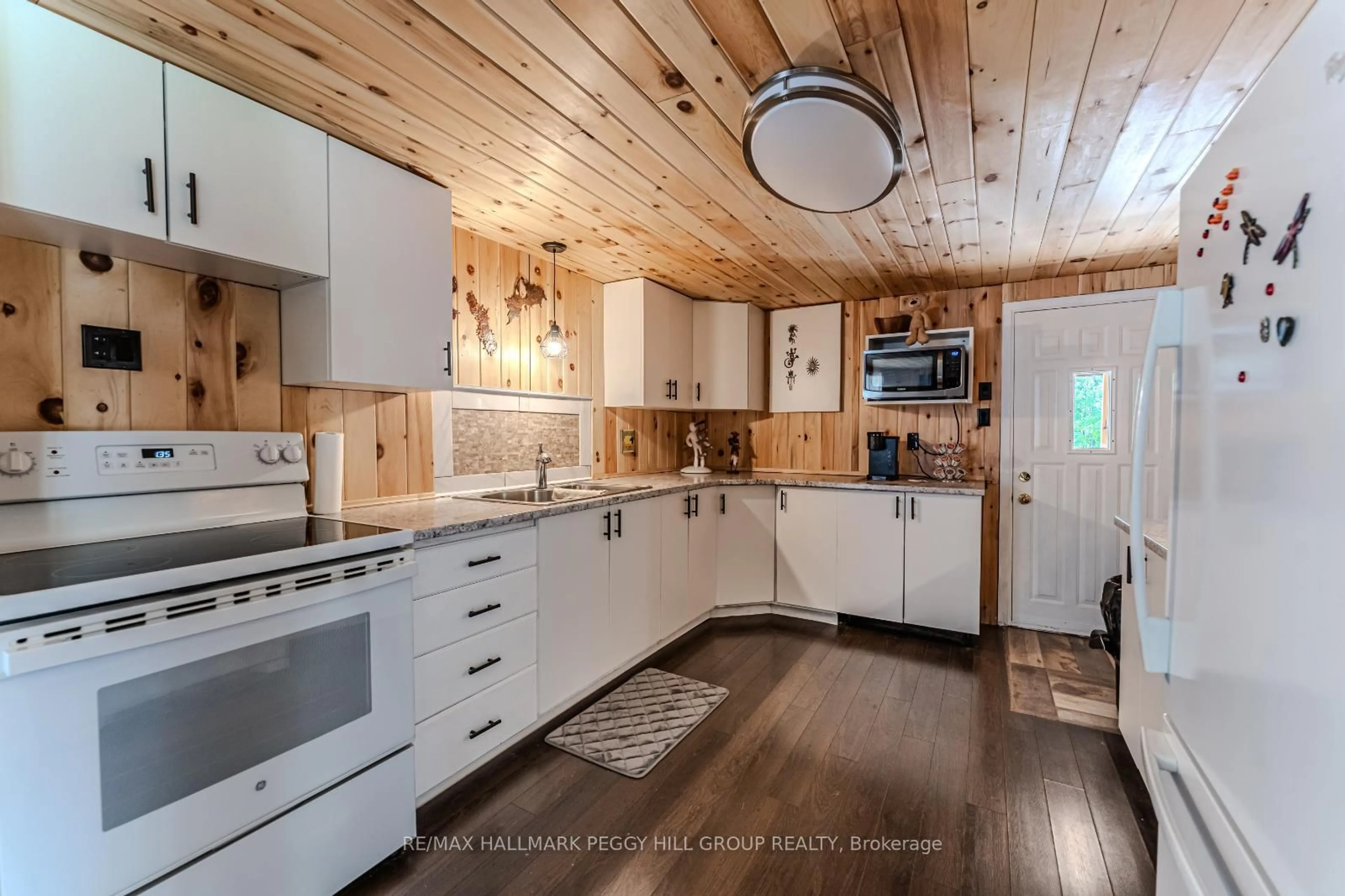 Open concept kitchen, wood/laminate floor for 156 Woodlands Ave, Tay Ontario L0K 1R0