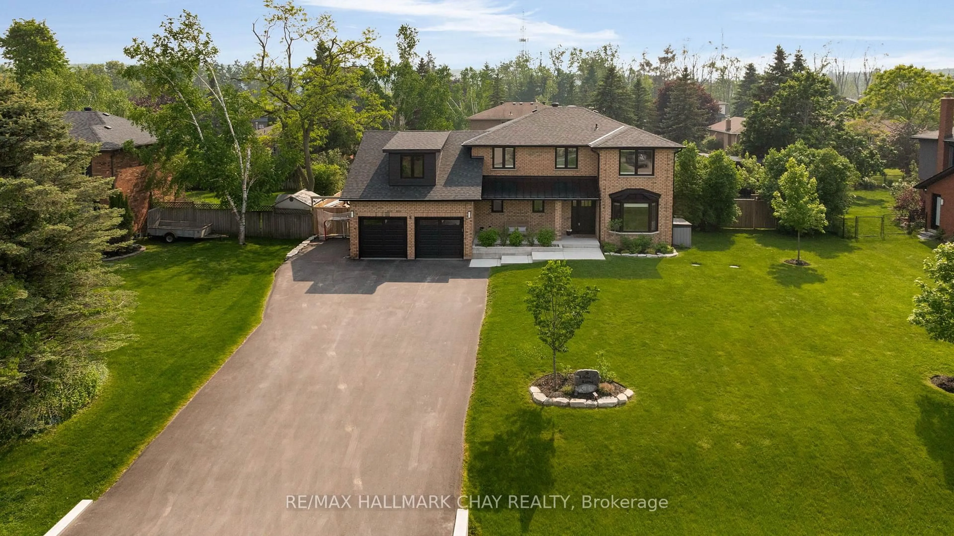 A pic from outside/outdoor area/front of a property/back of a property/a pic from drone, unknown for 5 Lilac Lane, Springwater Ontario L0L 1X1