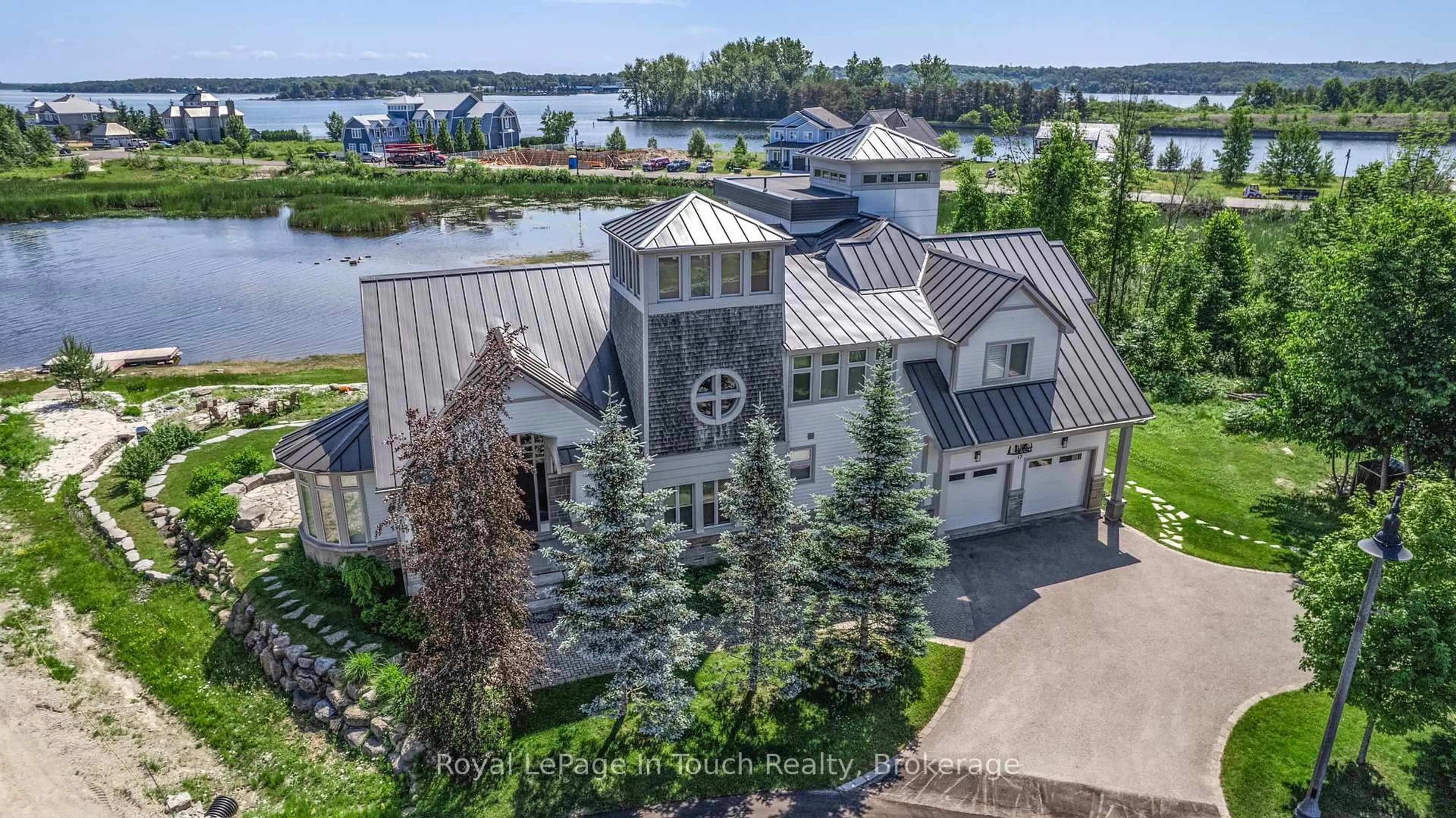 A pic from outside/outdoor area/front of a property/back of a property/a pic from drone, water/lake/river/ocean view for 17 Swan Lane, Tay Ontario L0K 1R0