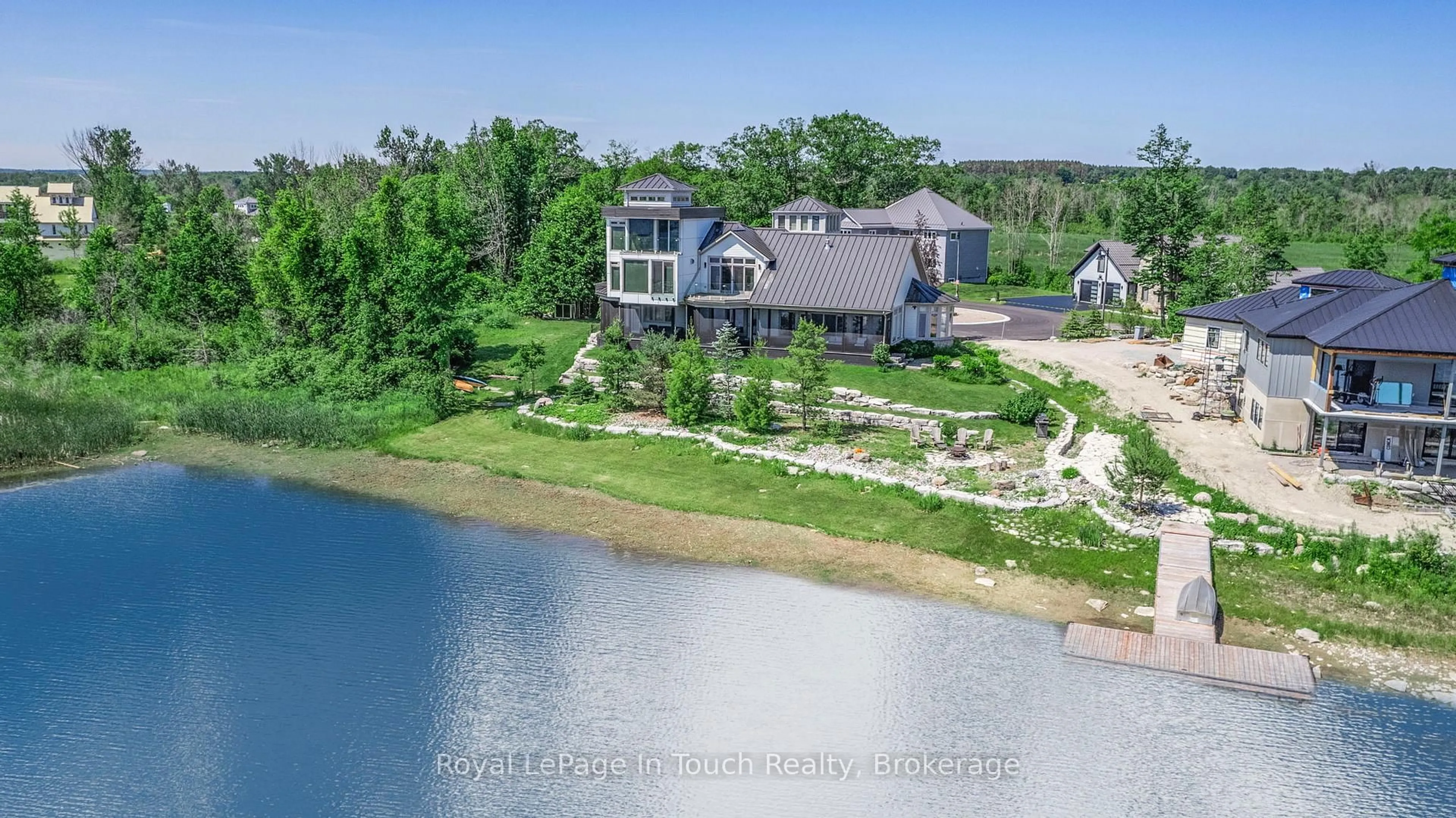 A pic from outside/outdoor area/front of a property/back of a property/a pic from drone, water/lake/river/ocean view for 17 Swan Lane, Tay Ontario L0K 1R0