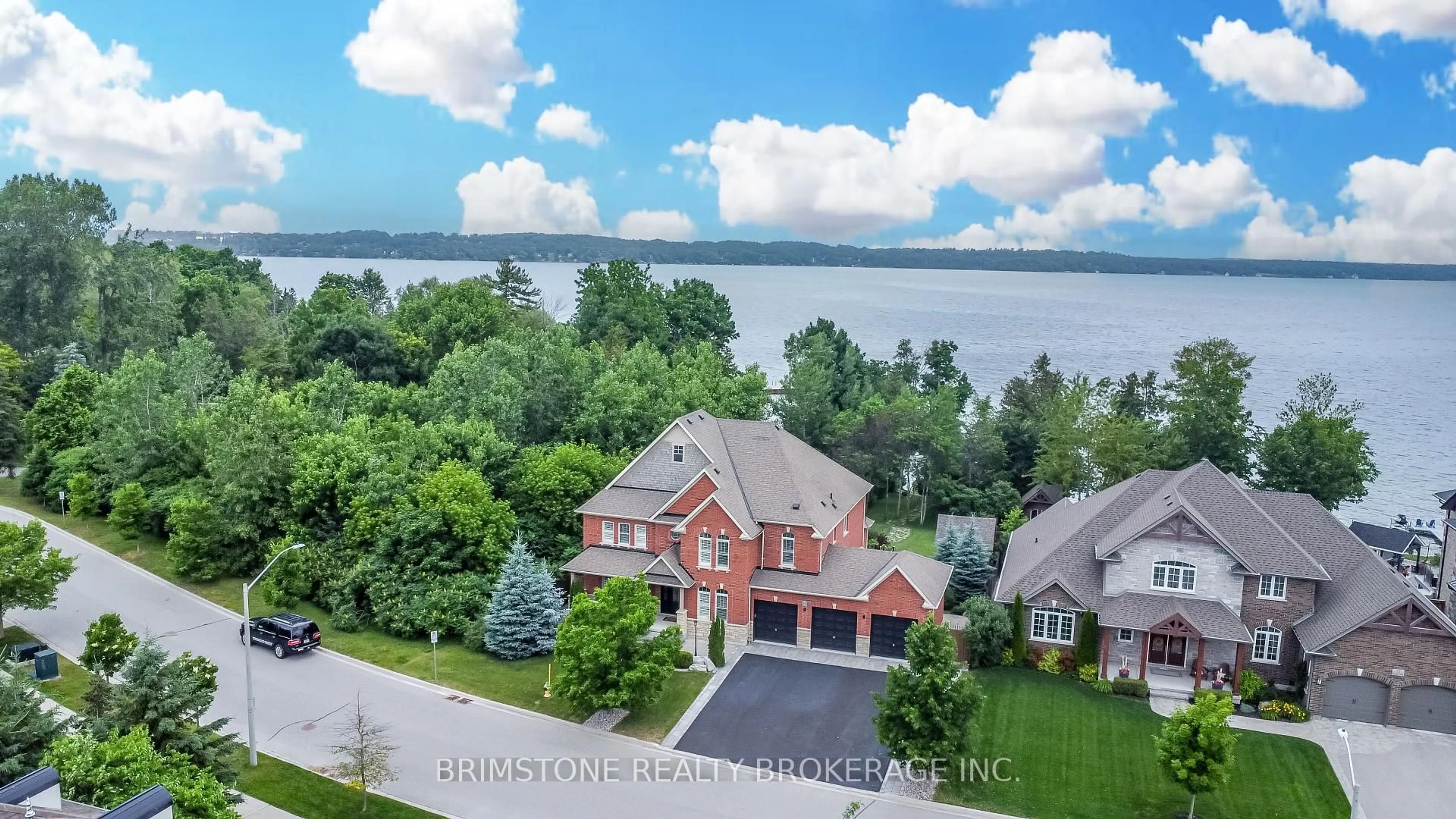 A pic from outside/outdoor area/front of a property/back of a property/a pic from drone, water/lake/river/ocean view for 31 Plunkett Crt, Barrie Ontario L4N 6M3