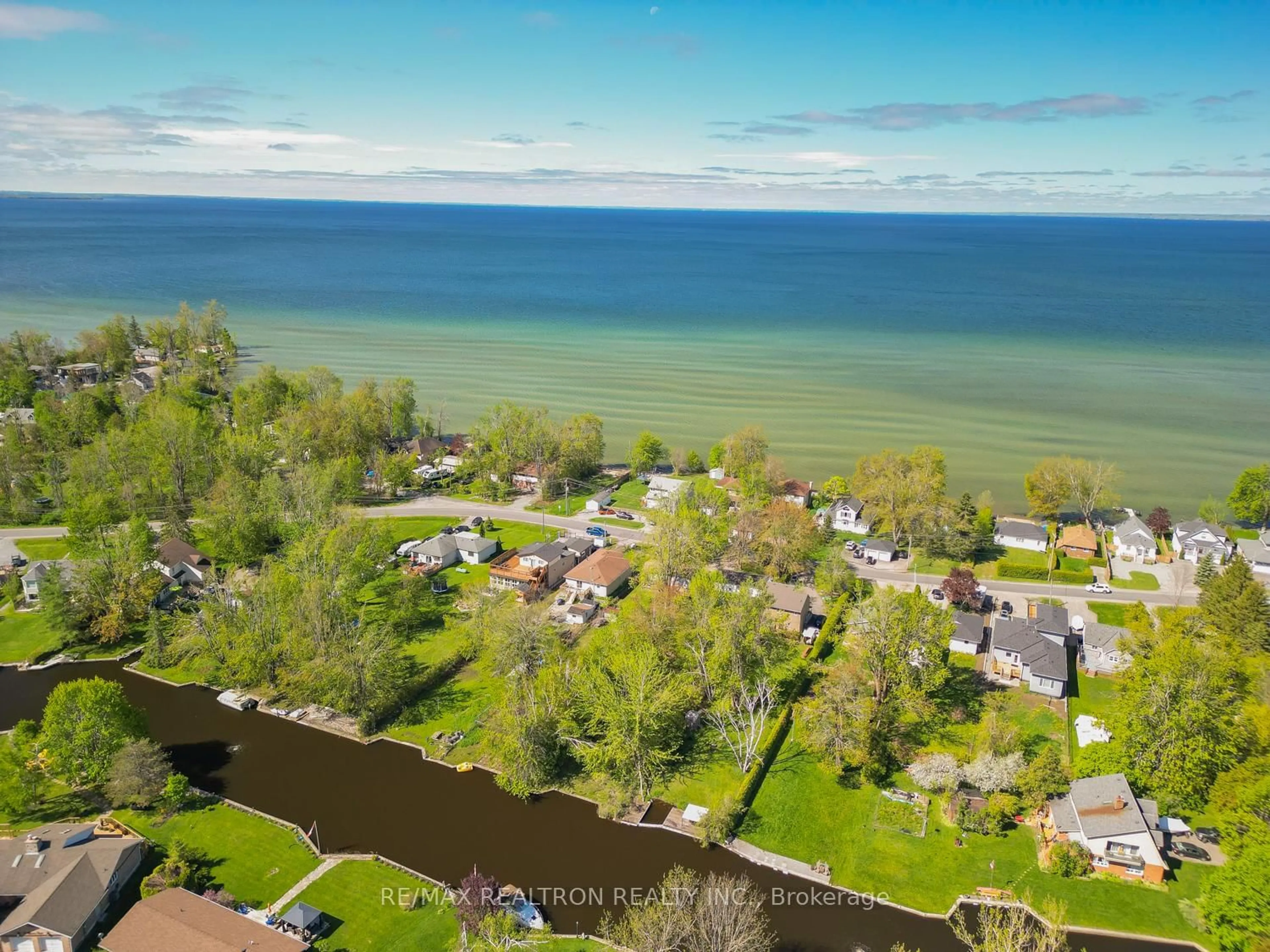 A pic from outside/outdoor area/front of a property/back of a property/a pic from drone, water/lake/river/ocean view for 31 Lake Ave, Ramara Ontario L0K 1B0