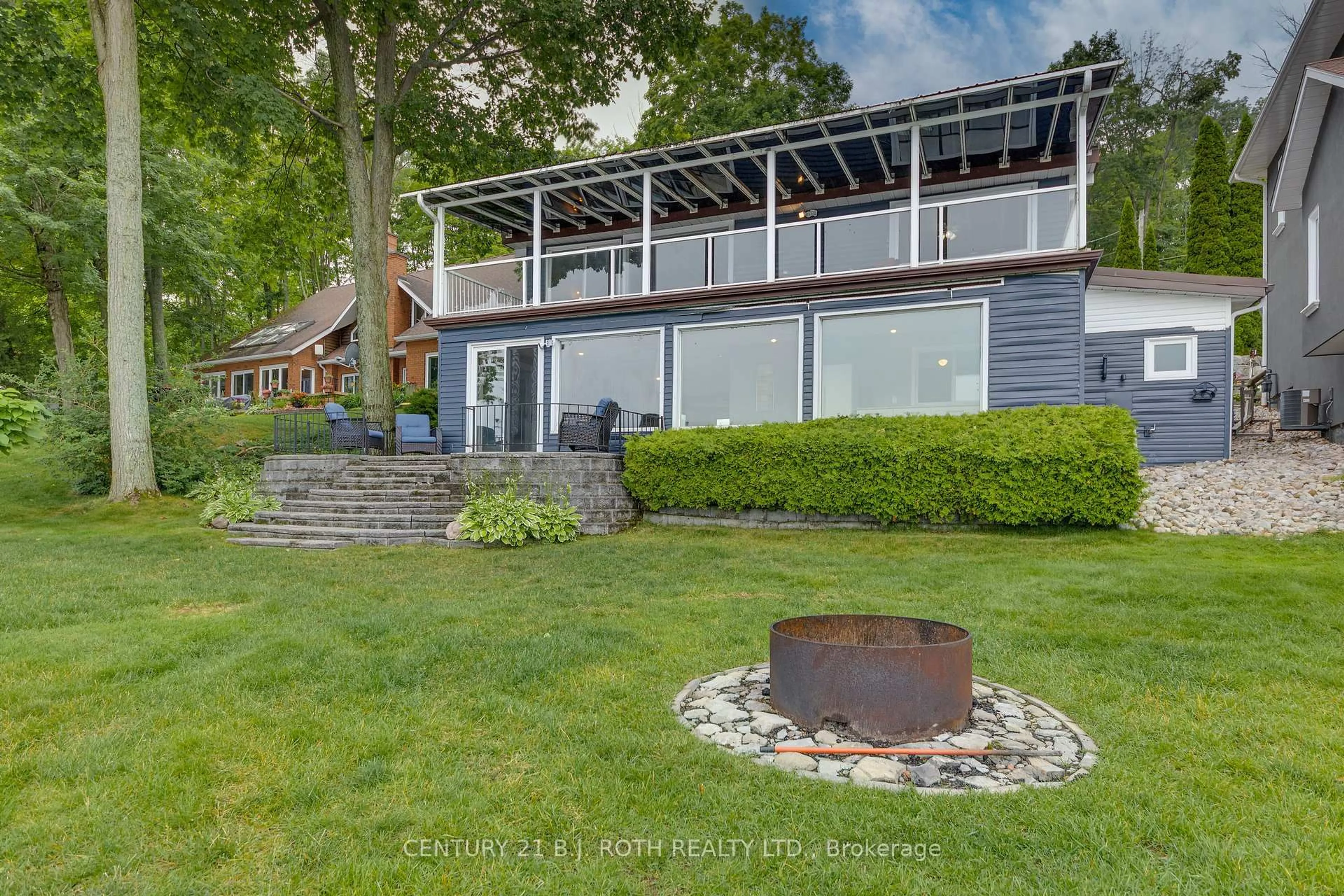 A pic from outside/outdoor area/front of a property/back of a property/a pic from drone, water/lake/river/ocean view for 409 Pheasant Lane, Midland Ontario L4R 5H3