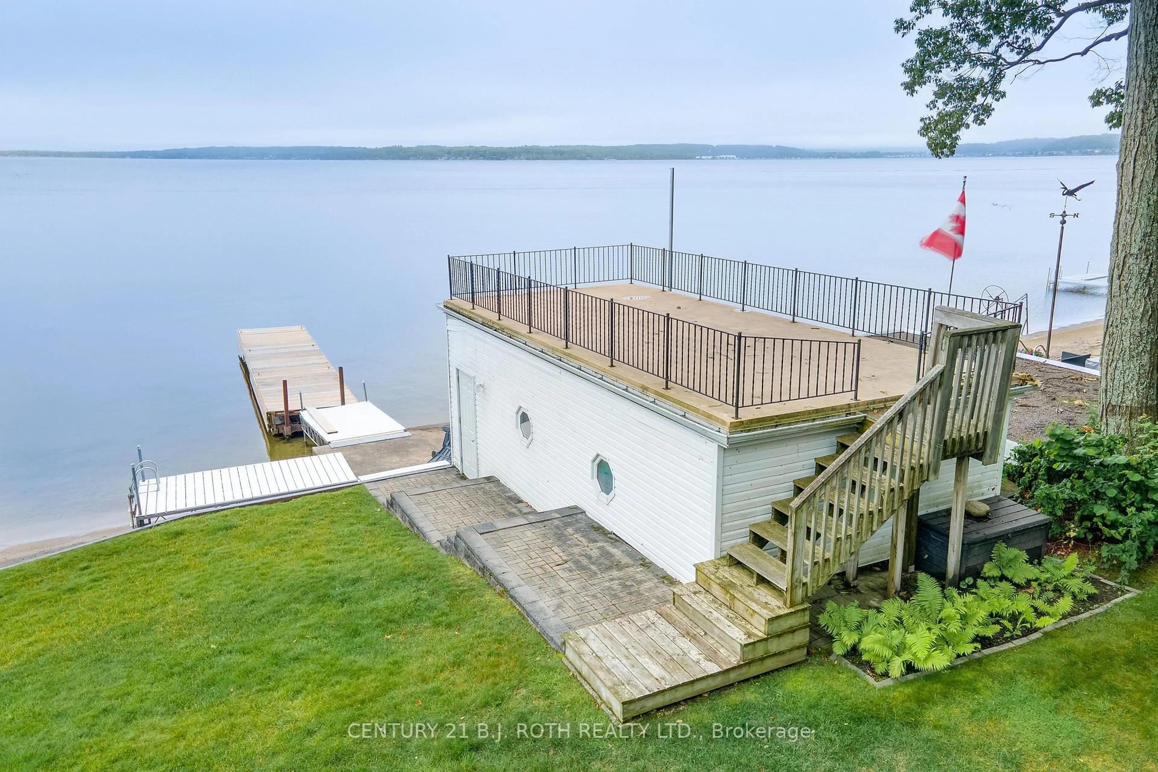 A pic from outside/outdoor area/front of a property/back of a property/a pic from drone, water/lake/river/ocean view for 409 Pheasant Lane, Midland Ontario L4R 5H3