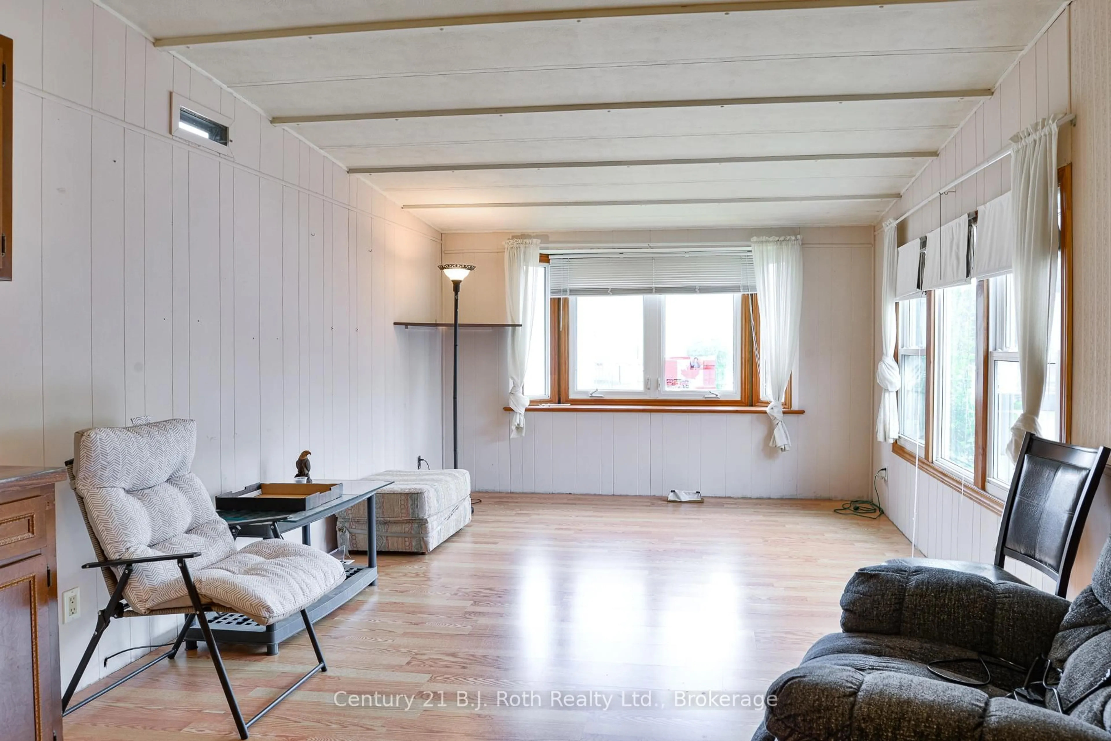 Living room with furniture, wood/laminate floor for 580 West St #178, Orillia Ontario L3V 6L8