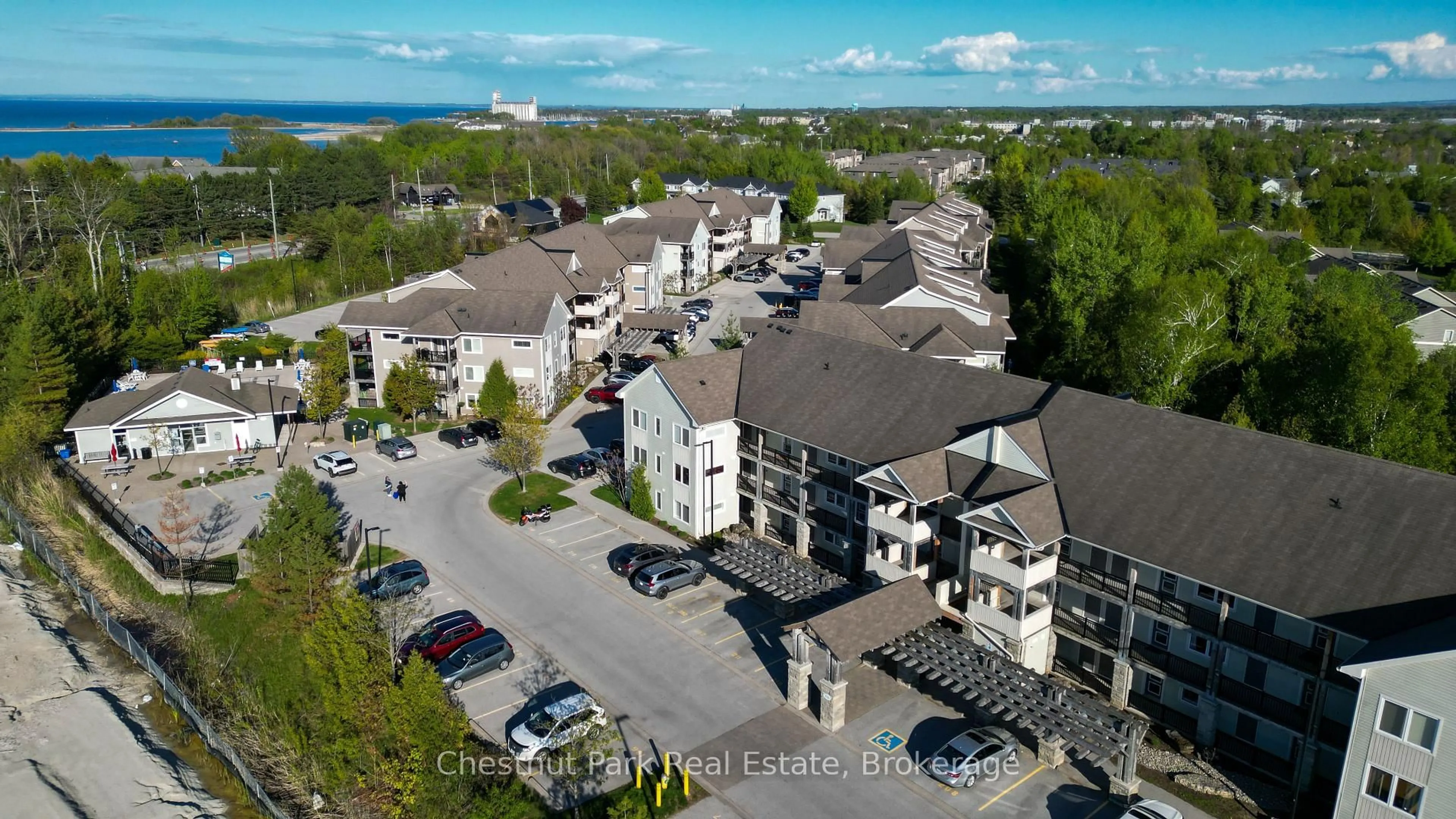 A pic from outside/outdoor area/front of a property/back of a property/a pic from drone, mountain view for 6 Brandy Lane Dr #302, Collingwood Ontario L9Y 0X4