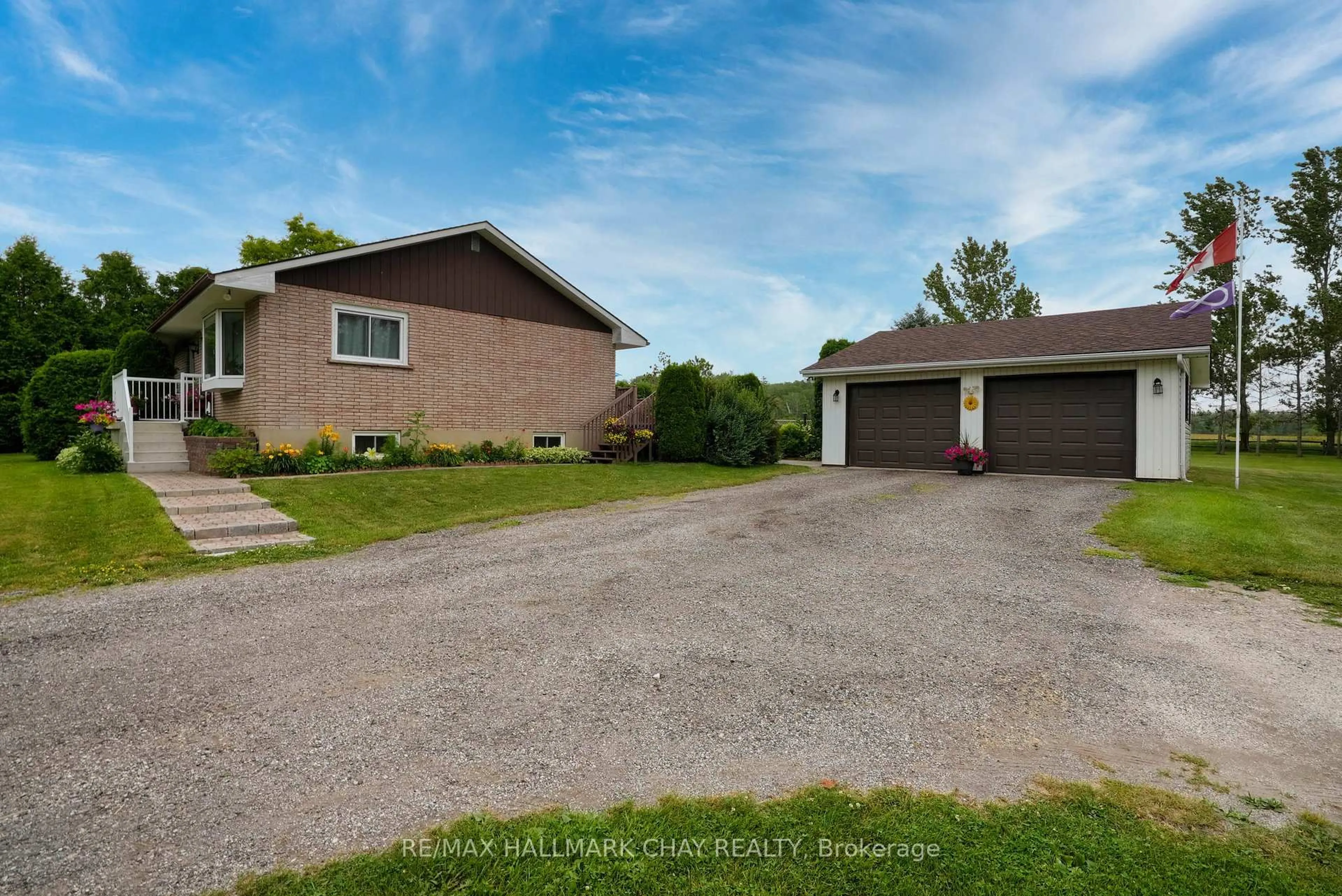 A pic from outside/outdoor area/front of a property/back of a property/a pic from drone, street for 1243 Flos Eight Rd, Springwater Ontario L0L 1P0