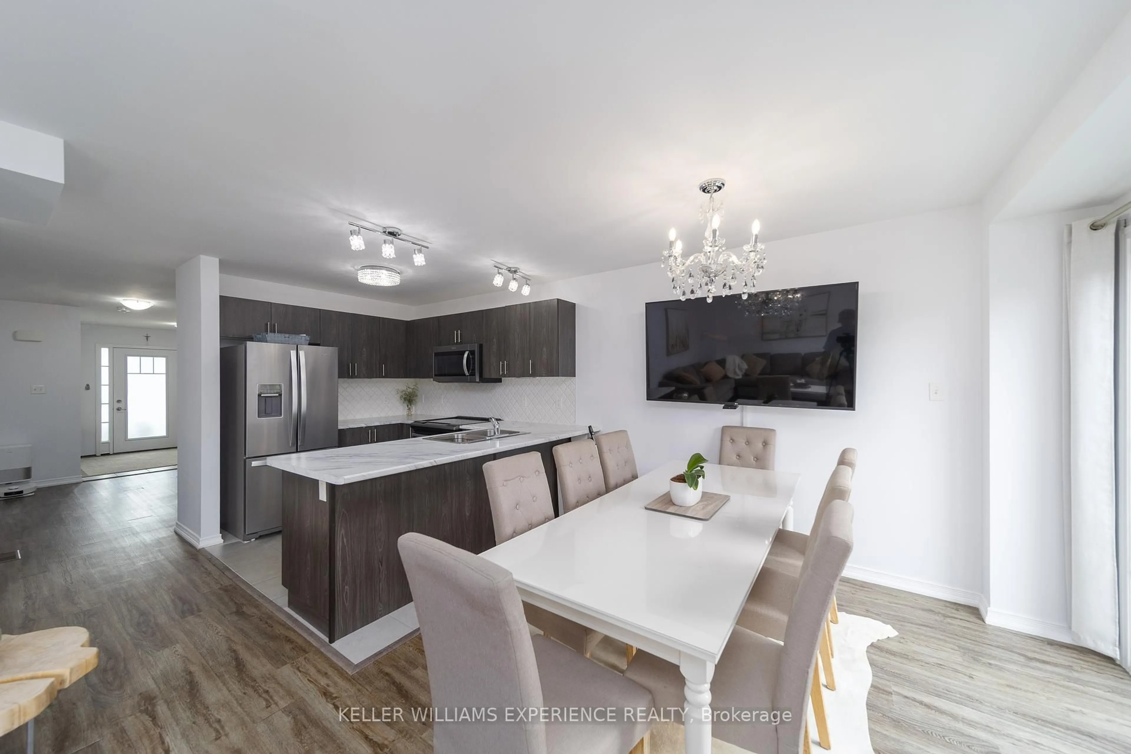 Open concept kitchen, wood/laminate floor for 76 Mabern St, Barrie Ontario L9J 0J2