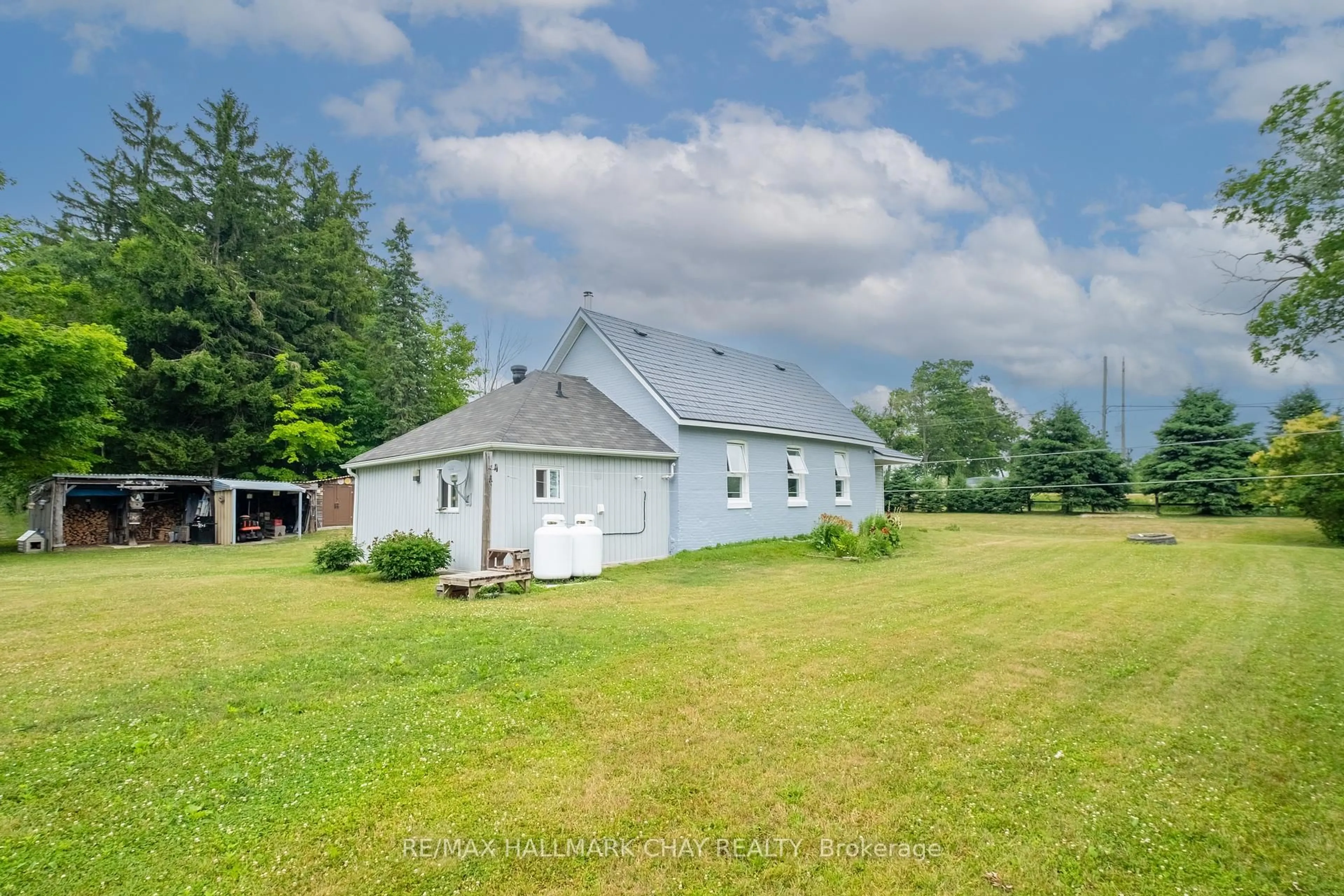 A pic from outside/outdoor area/front of a property/back of a property/a pic from drone, building for 12968 County 27 Rd, Springwater Ontario L0L 2K0