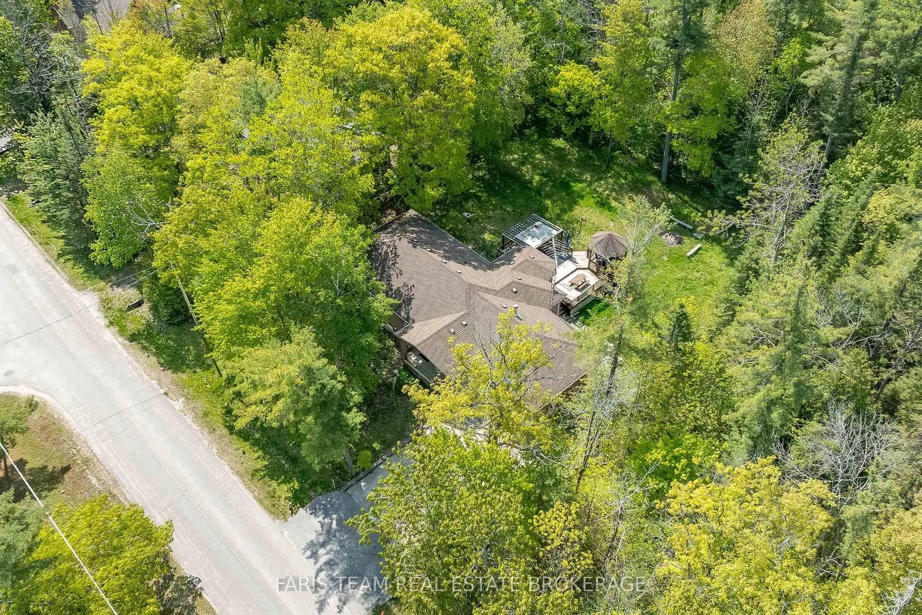A pic from outside/outdoor area/front of a property/back of a property/a pic from drone, forest/trees view for 64 Nadia Cres, Tiny Ontario L0L 2T0