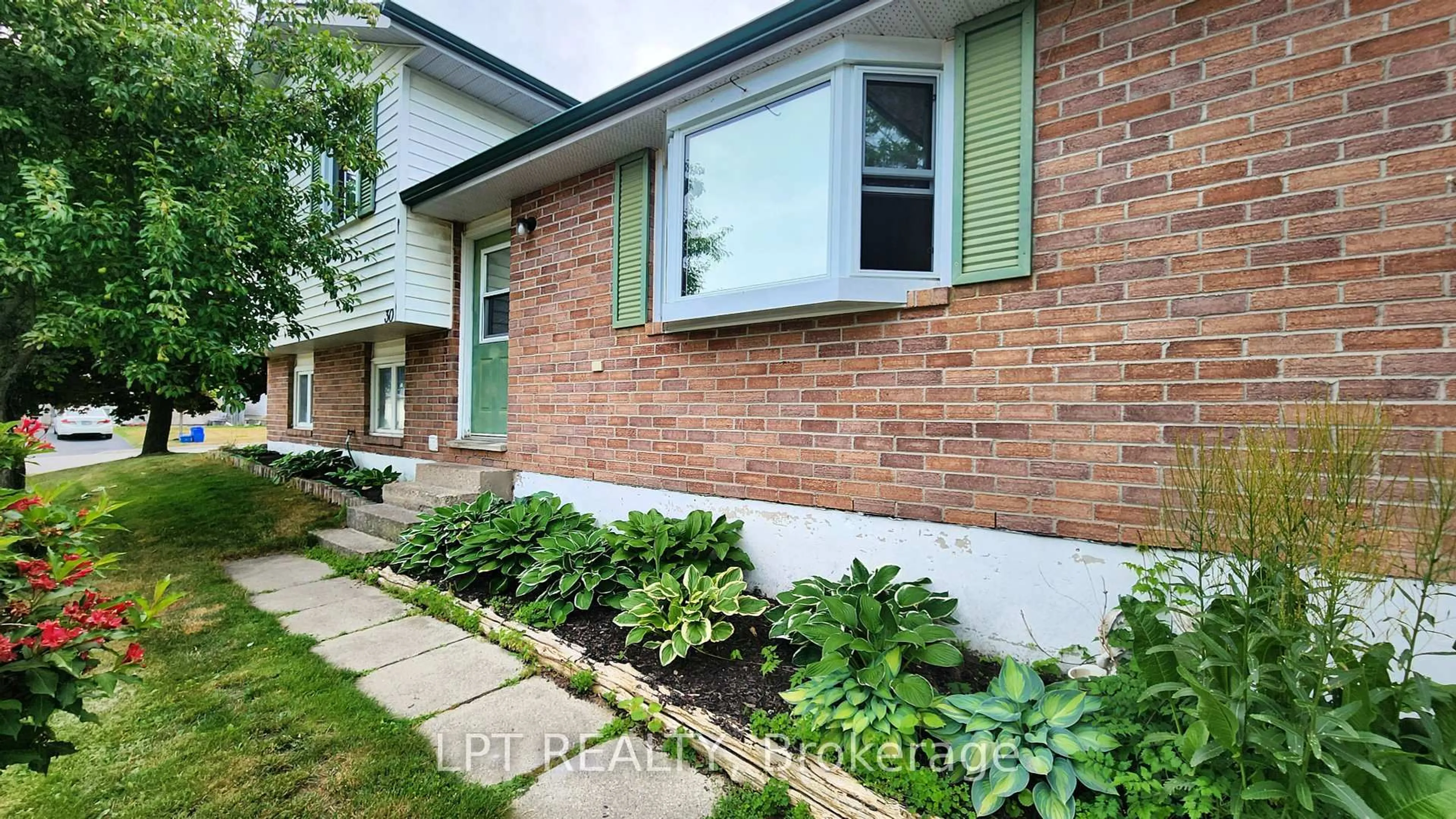 Home with brick exterior material, street for 30 McConkey Pl, Barrie Ontario L4N 6H1