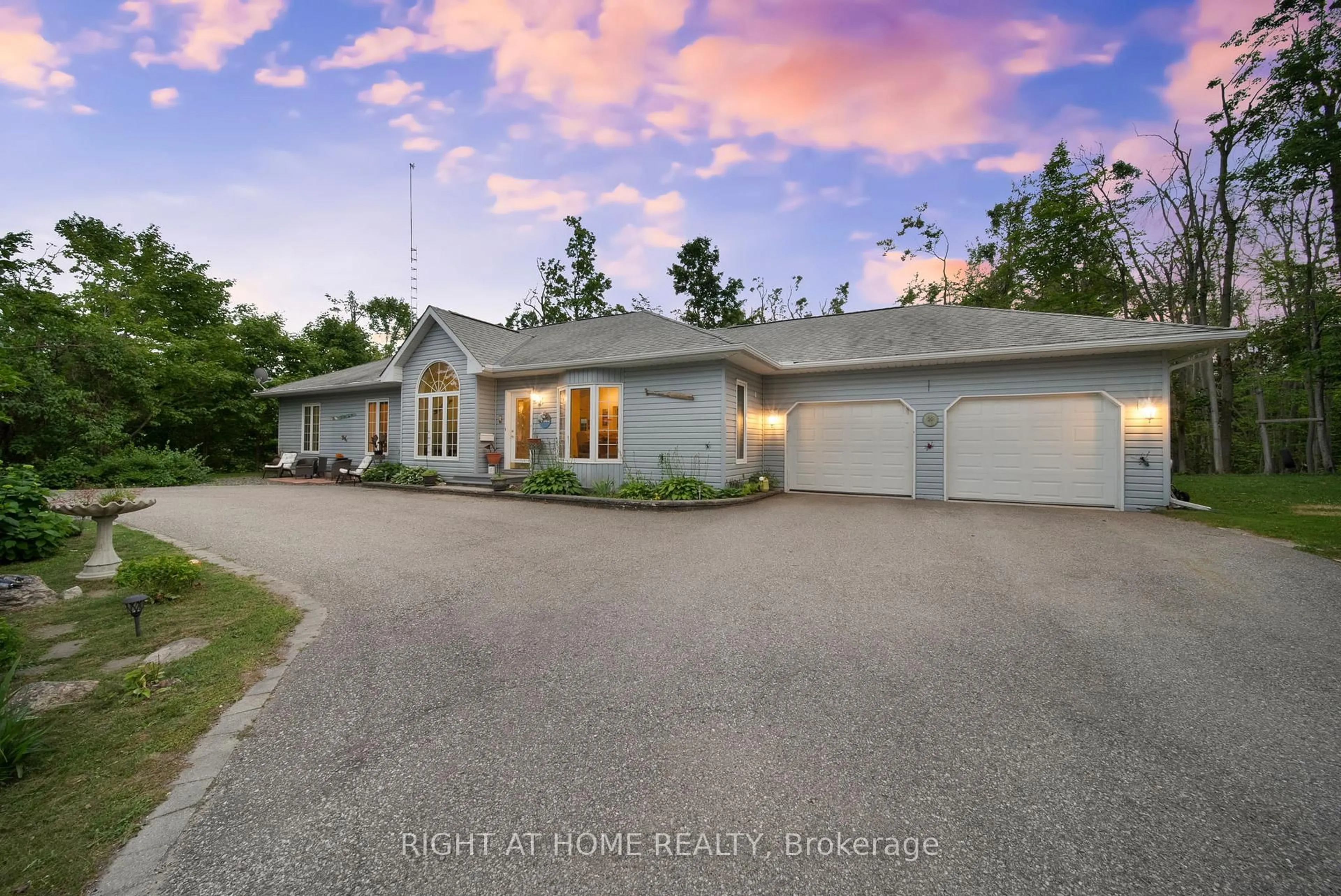 A pic from outside/outdoor area/front of a property/back of a property/a pic from drone, unknown for 4 Beechwood Cres, Oro-Medonte Ontario L0L 1T0