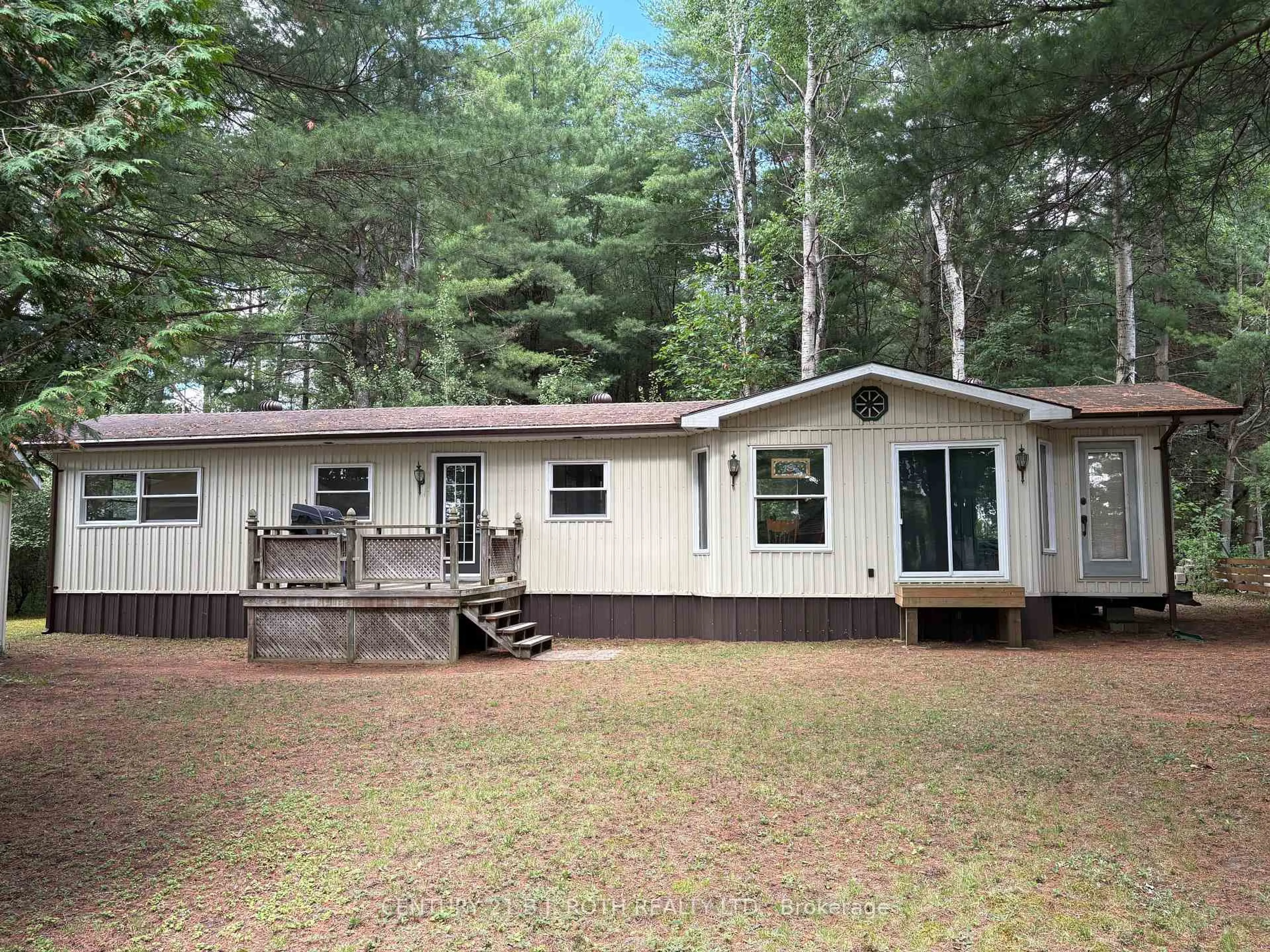 Home with vinyl exterior material, forest/trees view for 5216 90 County Rd #81, Springwater Ontario L0M 1T2