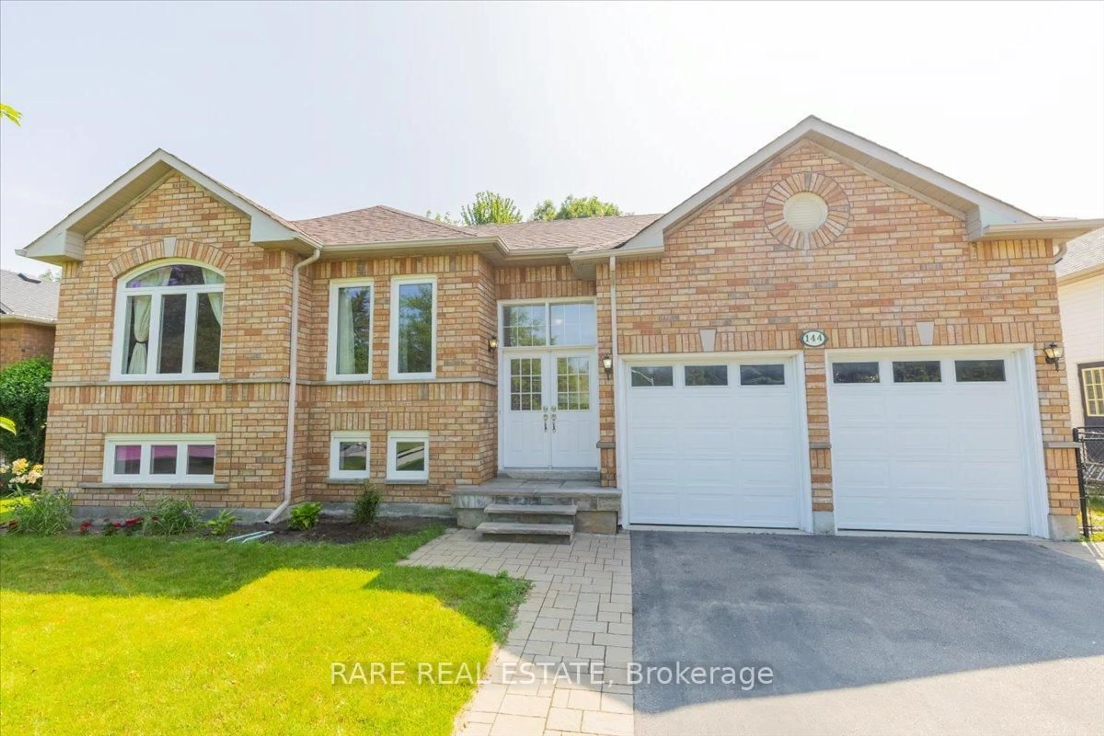 Home with brick exterior material, street for 144 Silver Birch Ave, Wasaga Beach Ontario L9Z 1N3