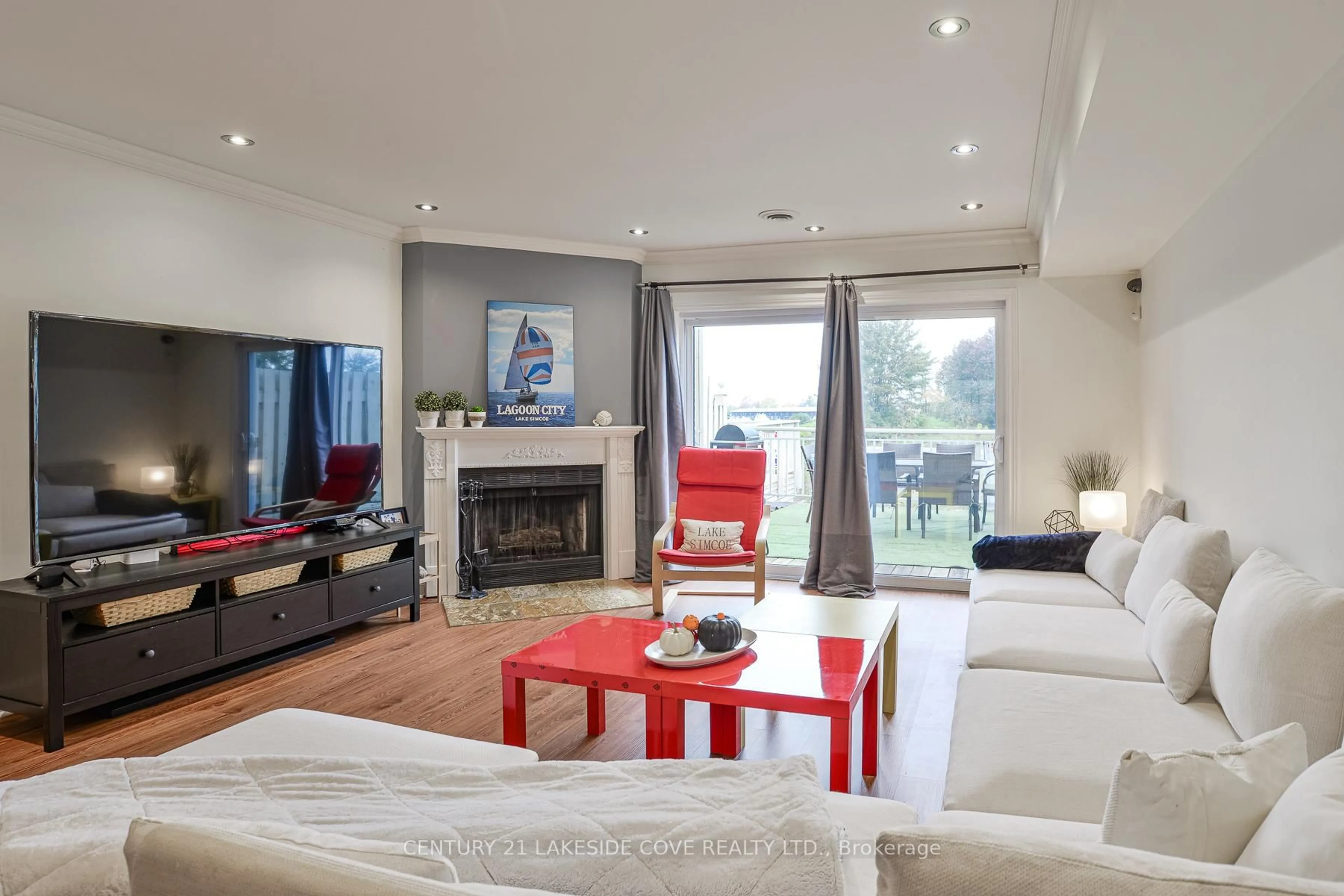Living room with furniture, wood/laminate floor for 100 Laguna Pkwy #23, Ramara Ontario L0K 1B0