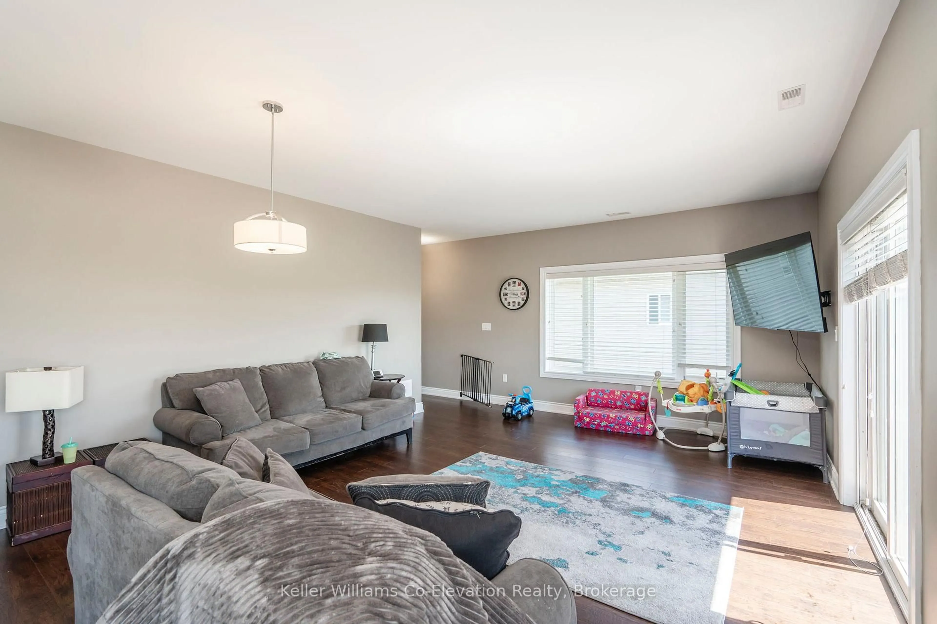 Living room with furniture, wood/laminate floor for 3931 Wood Ave, Severn Ontario L3V 0T9