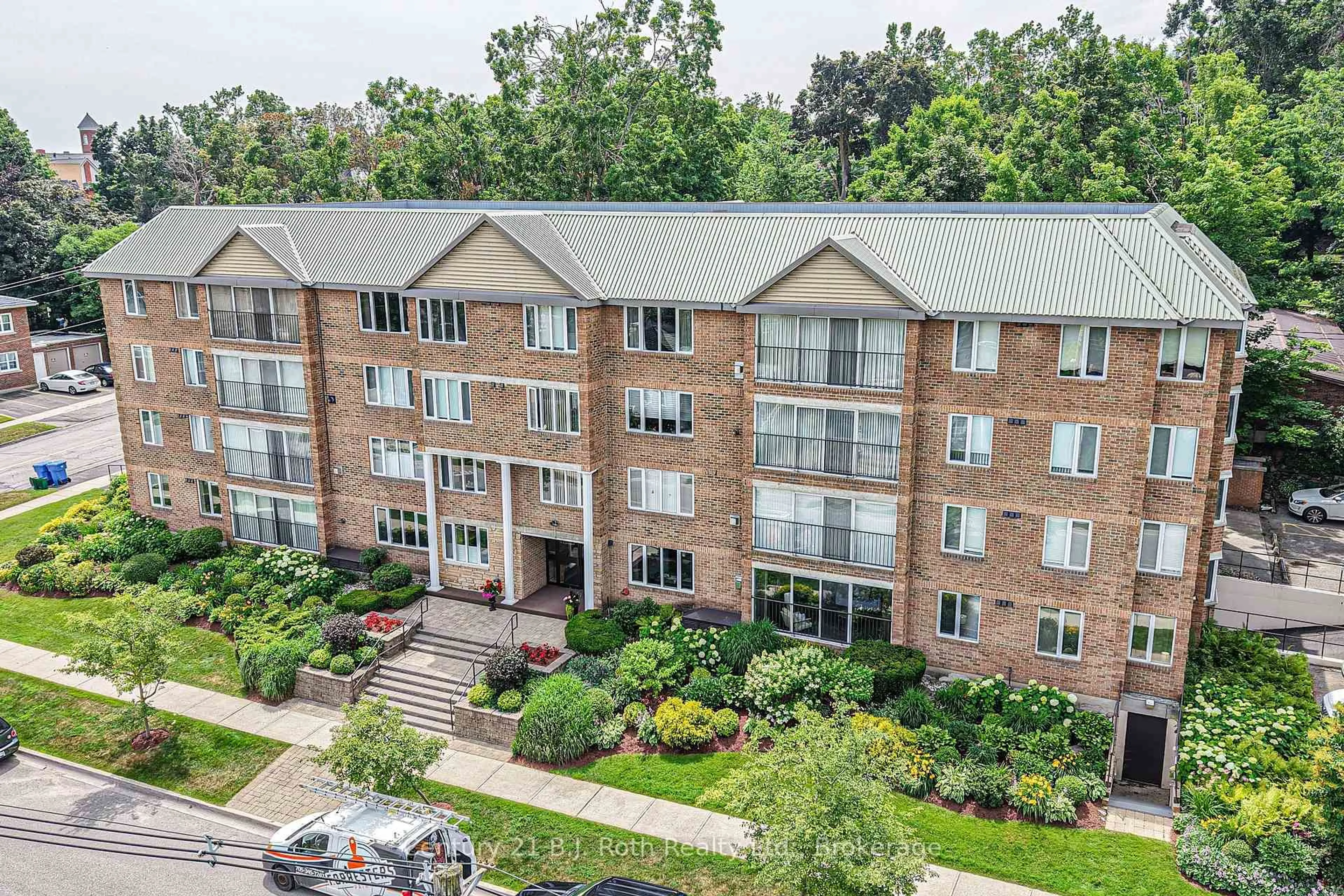 A pic from outside/outdoor area/front of a property/back of a property/a pic from drone, city buildings view from balcony for 95 Matchedash St #104, Orillia Ontario L3V 4T9
