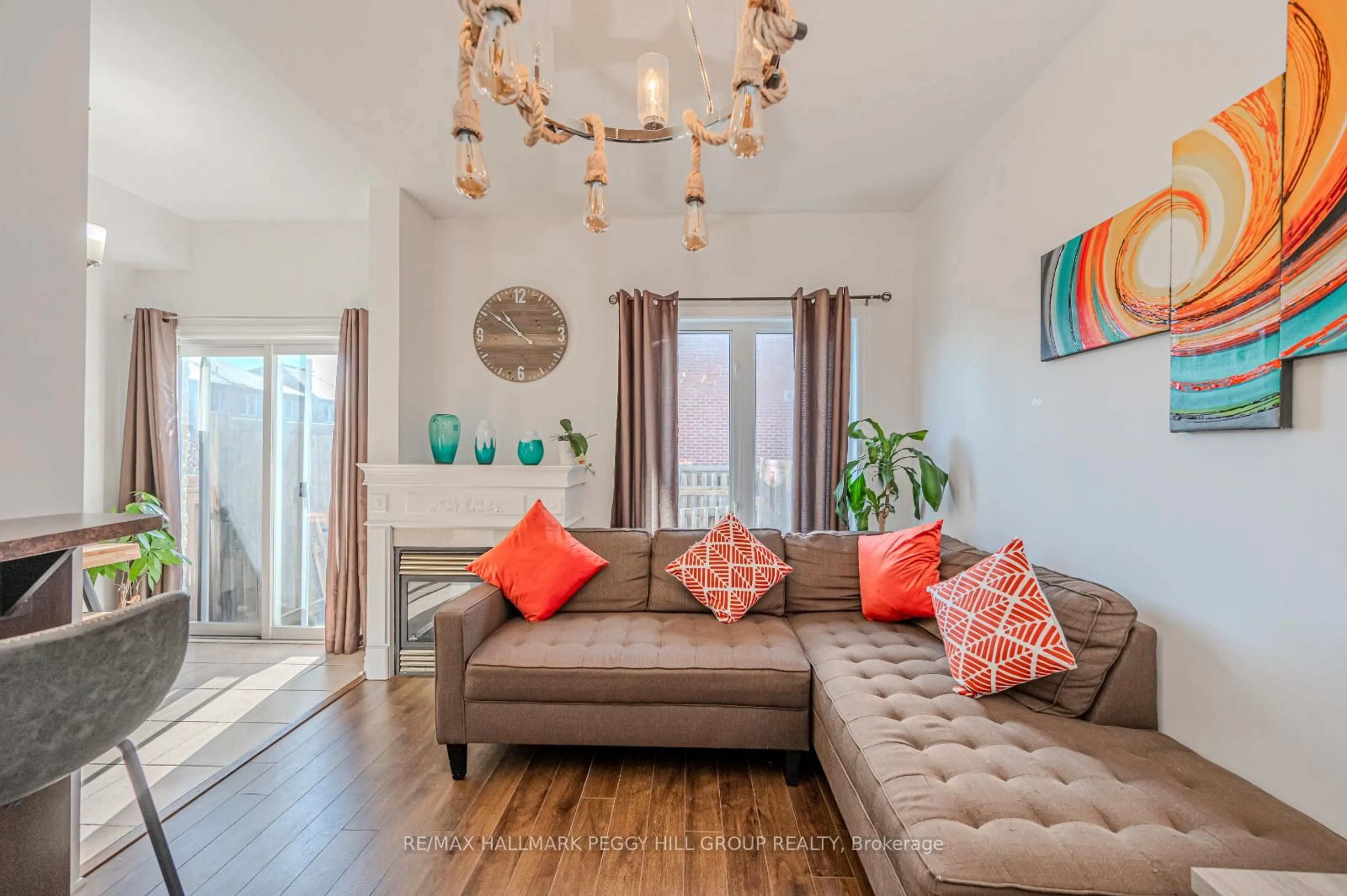 Living room with furniture, wood/laminate floor for 5 Arch Brown Crt, Barrie Ontario L4M 0C6