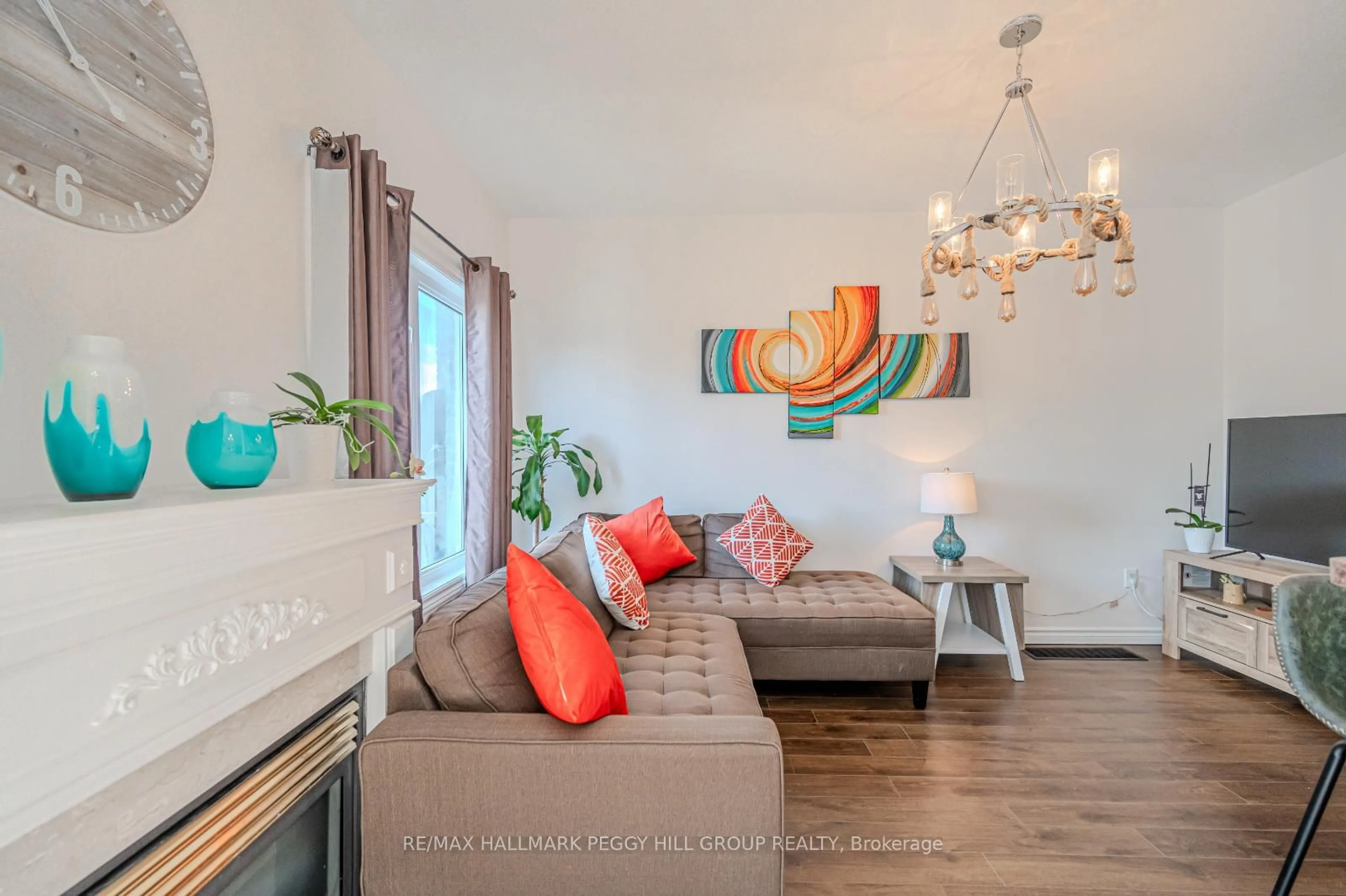 Living room with furniture, wood/laminate floor for 5 Arch Brown Crt, Barrie Ontario L4M 0C6