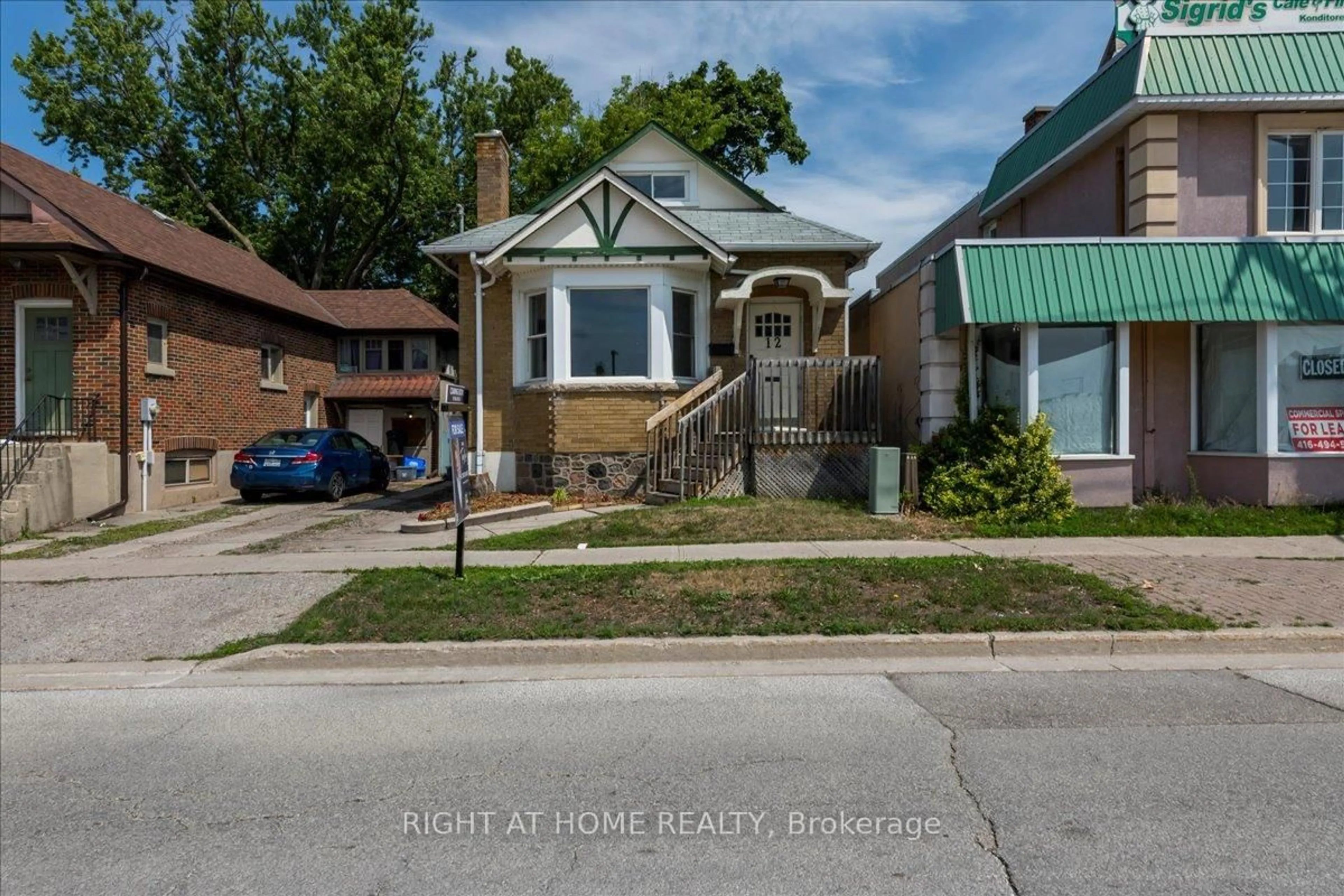 Home with brick exterior material, street for 12 Ross St, Barrie Ontario L4N 1E7