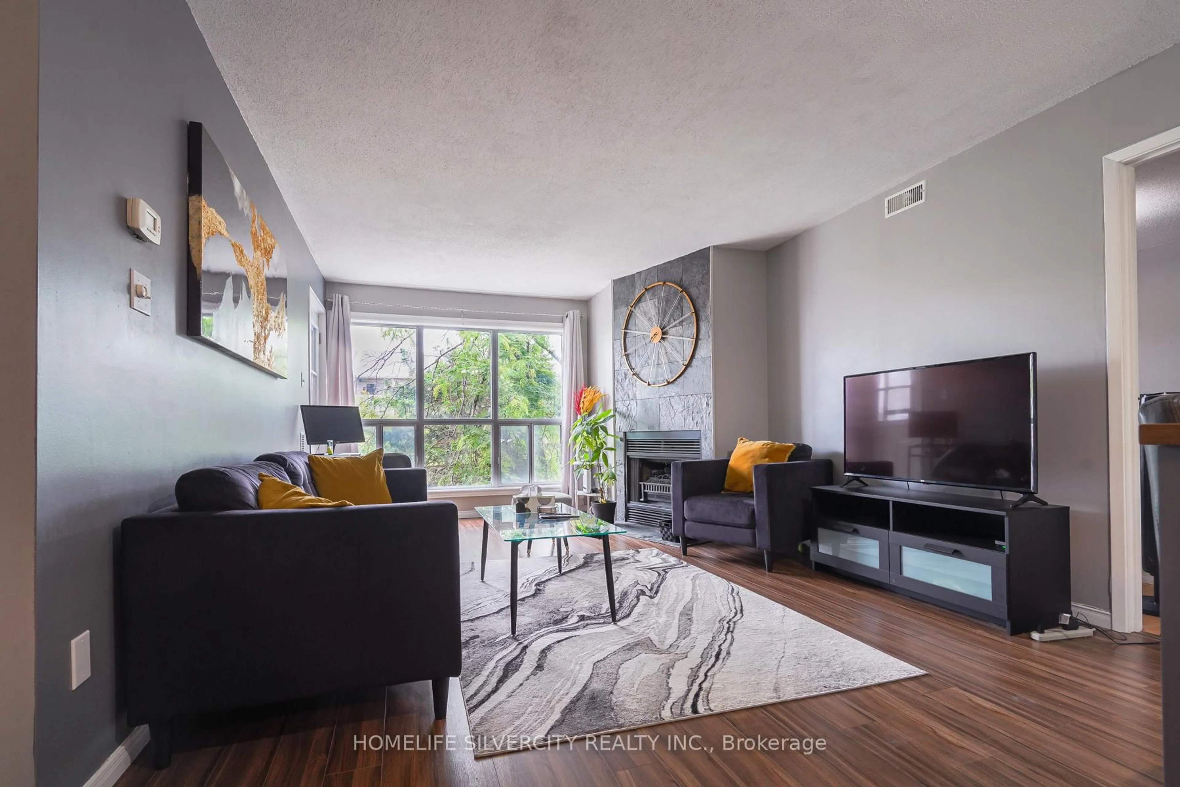 Living room with furniture, unknown for 120 Bell Farm Rd #316, Barrie Ontario L4M 6J2