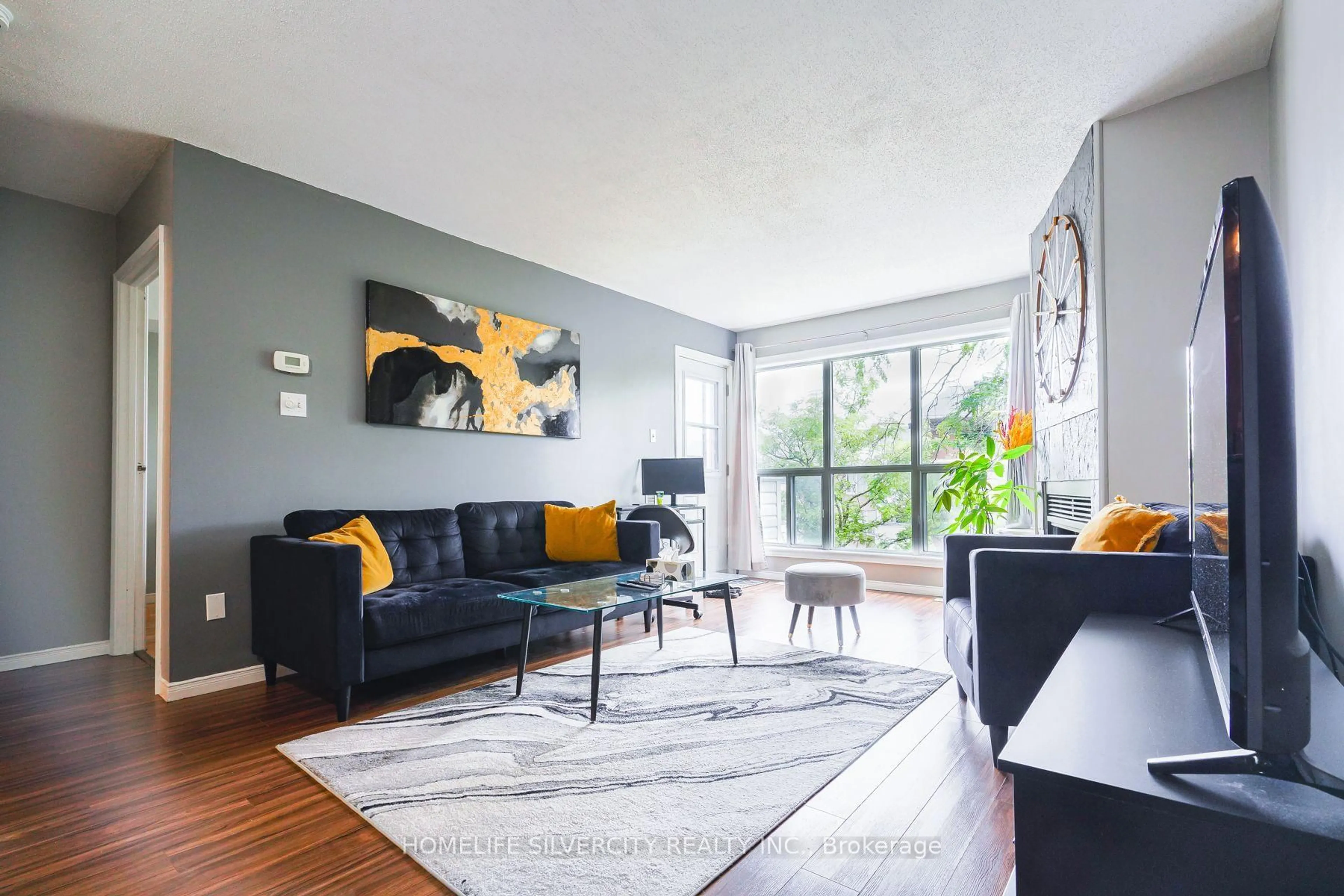 Living room with furniture, unknown for 120 Bell Farm Rd #316, Barrie Ontario L4M 6J2