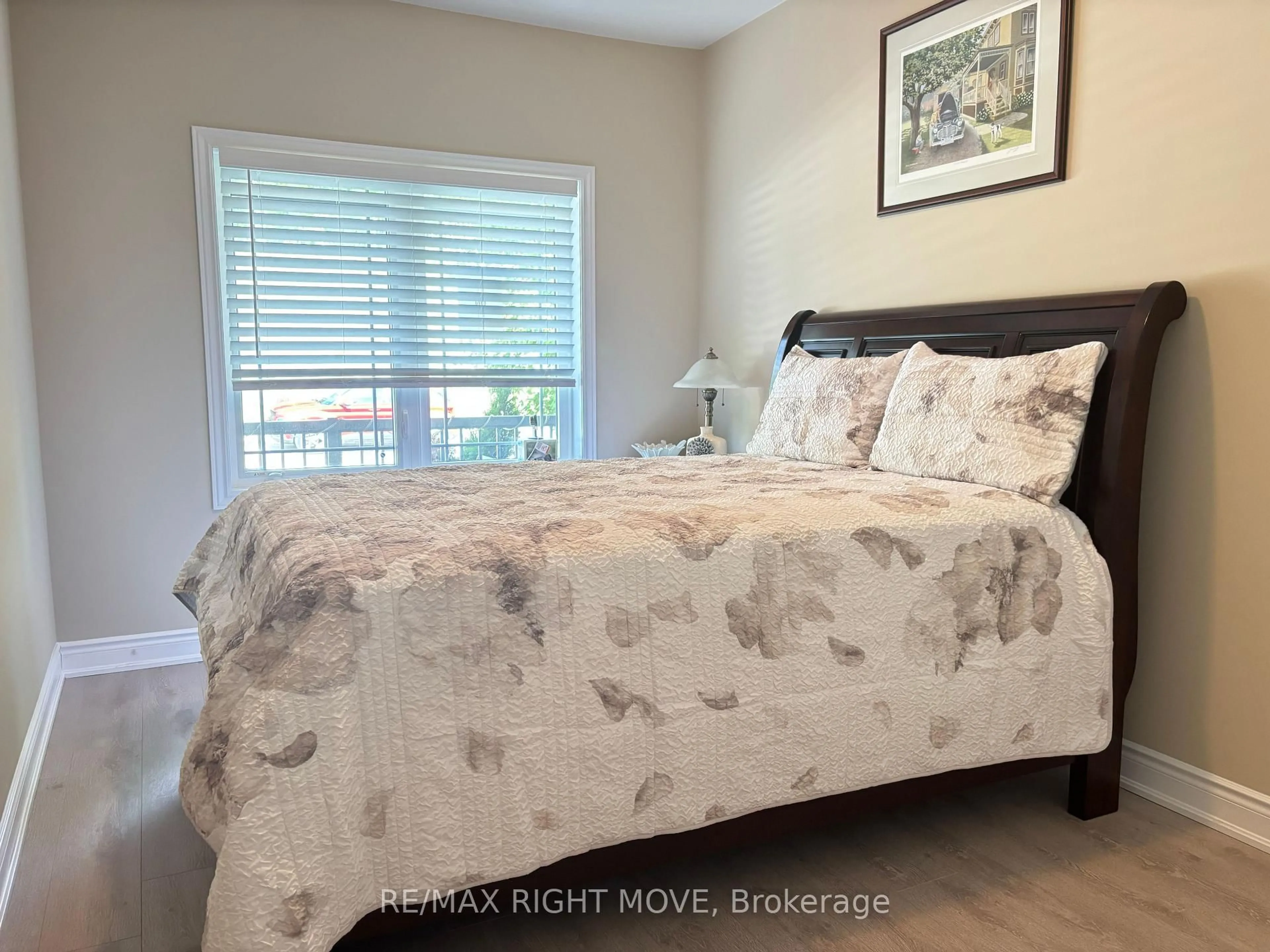 Bedroom with bed, wood/laminate floor for 128 Lily Dr, Orillia Ontario L3V 0G3