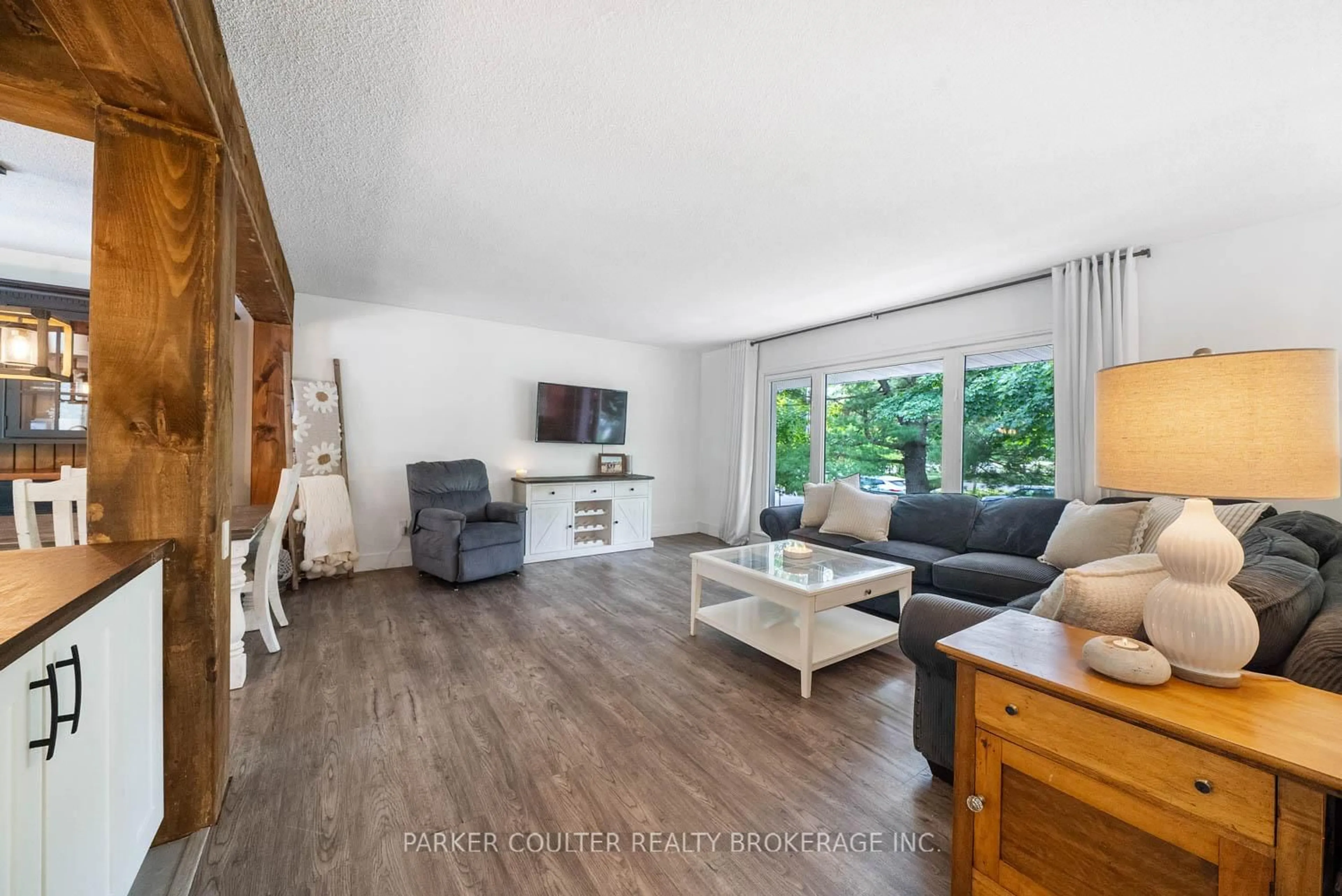 Living room with furniture, wood/laminate floor for 2 Noraline Ave, Springwater Ontario L0L 1X1