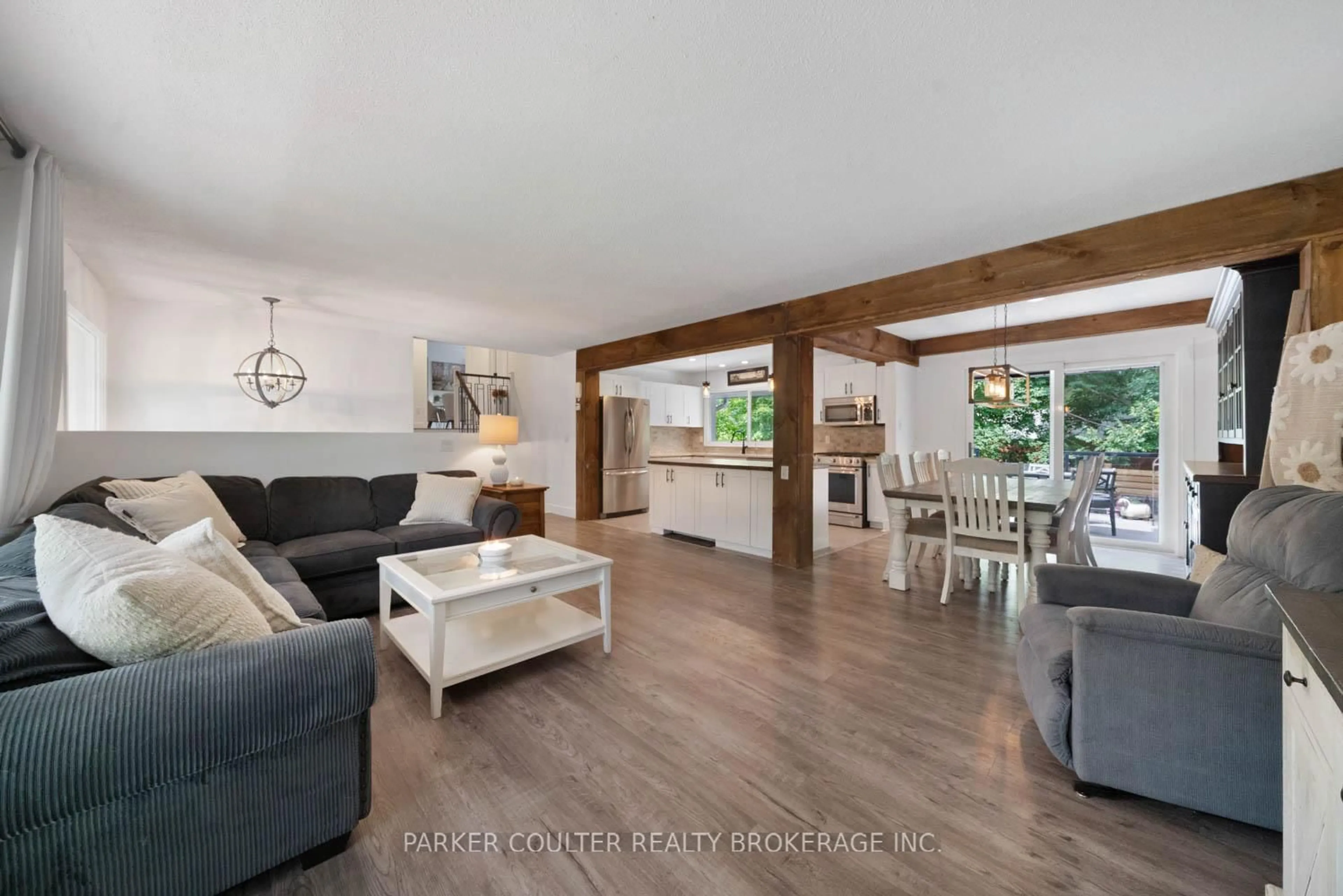 Living room with furniture, wood/laminate floor for 2 Noraline Ave, Springwater Ontario L0L 1X1