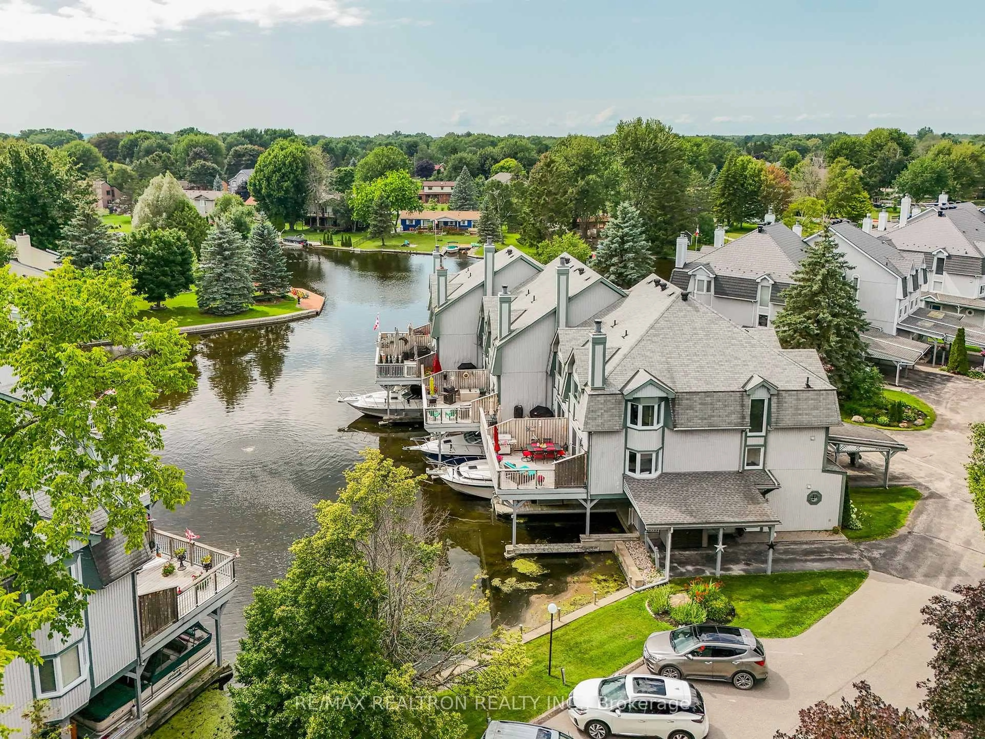 A pic from outside/outdoor area/front of a property/back of a property/a pic from drone, water/lake/river/ocean view for 24 Laguna Pkwy #7, Ramara Ontario L0K 1B0