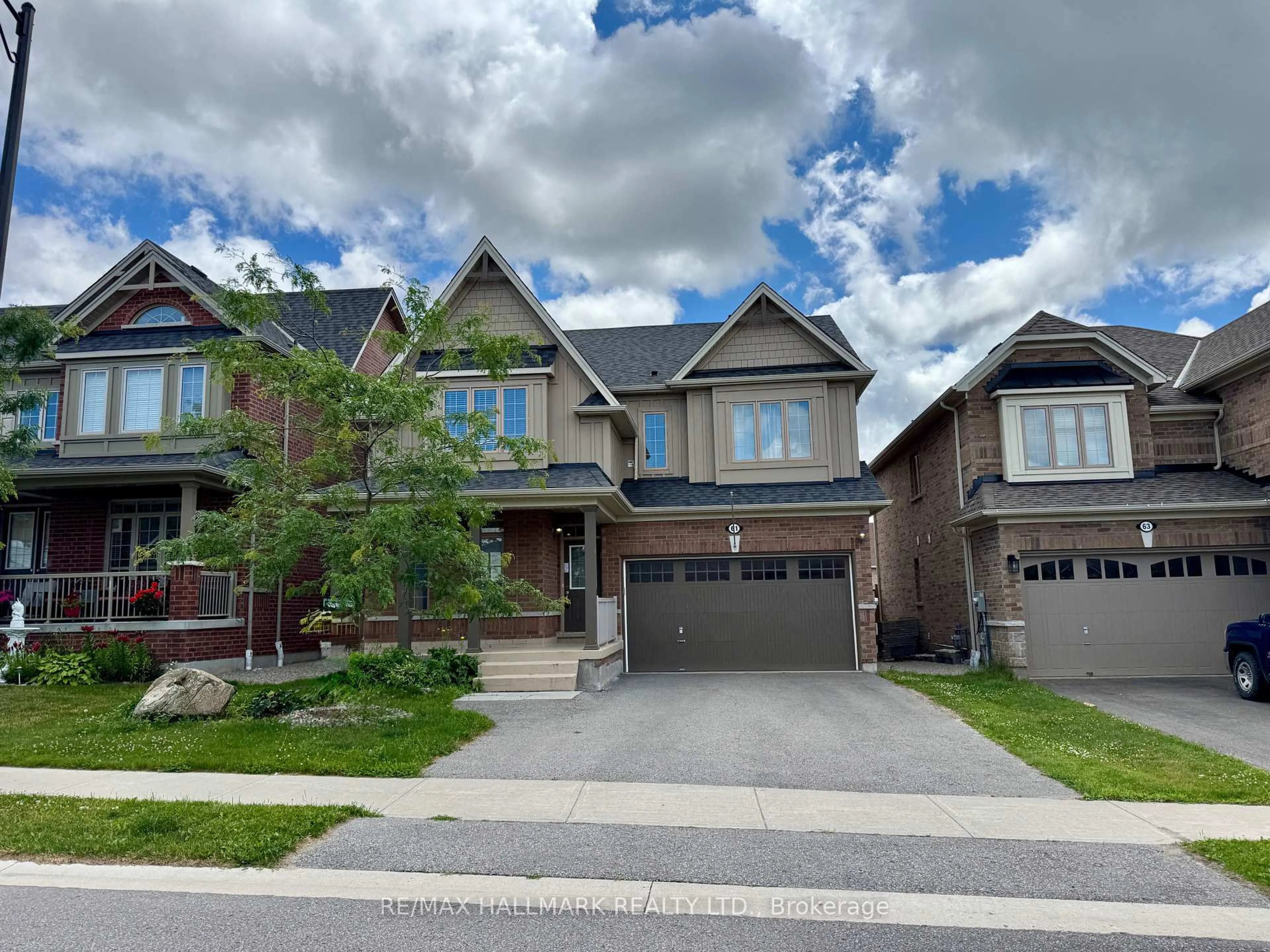 Home with brick exterior material, street for 61 McIsaac Dr, Springwater Ontario L4M 4S4