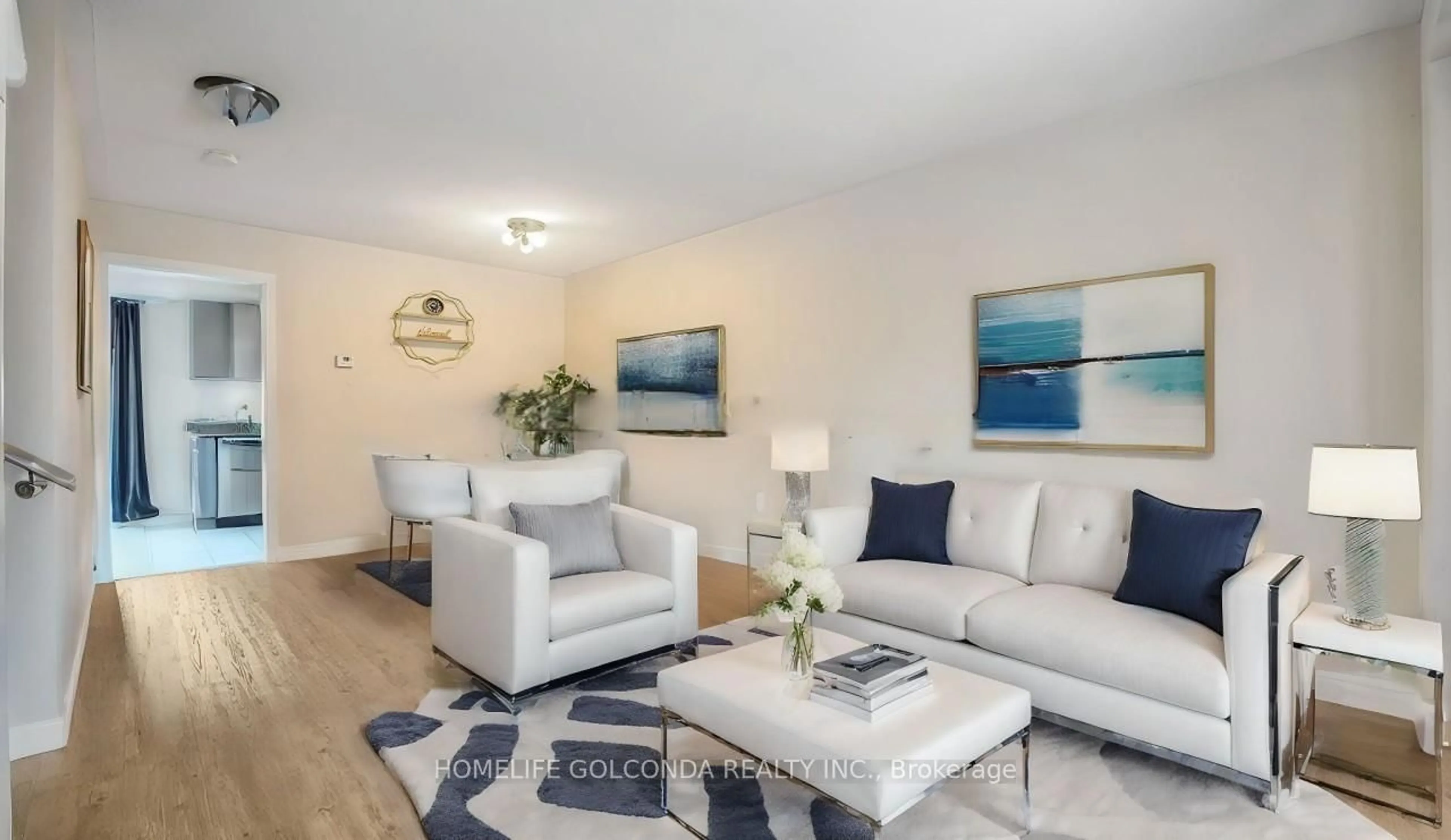Living room with furniture, wood/laminate floor for 21 Bentley Cres, Barrie Ontario L4N 0Z1