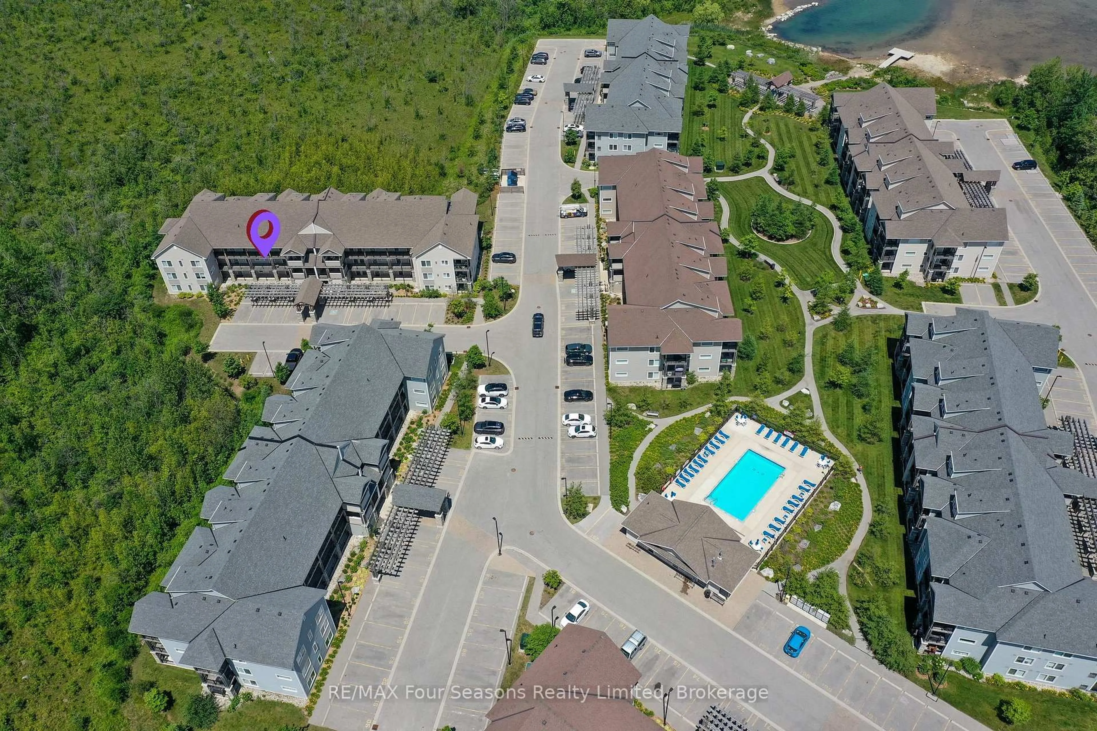 A pic from outside/outdoor area/front of a property/back of a property/a pic from drone, street for 6 Anchorage Cres #203, Collingwood Ontario L9Y 0Y6