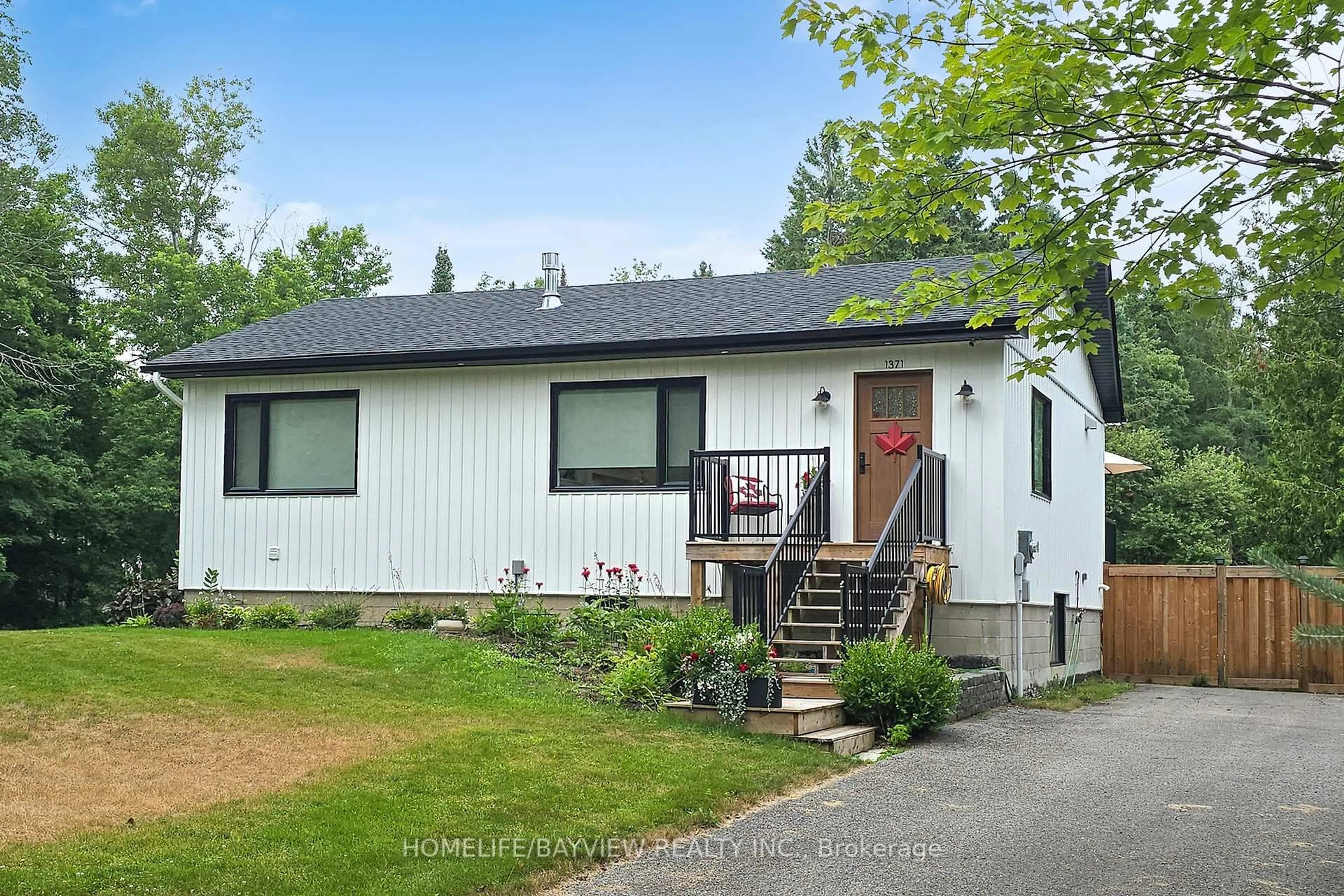 Home with vinyl exterior material, street for 1371 Gill Rd, Springwater Ontario L9X 1M3