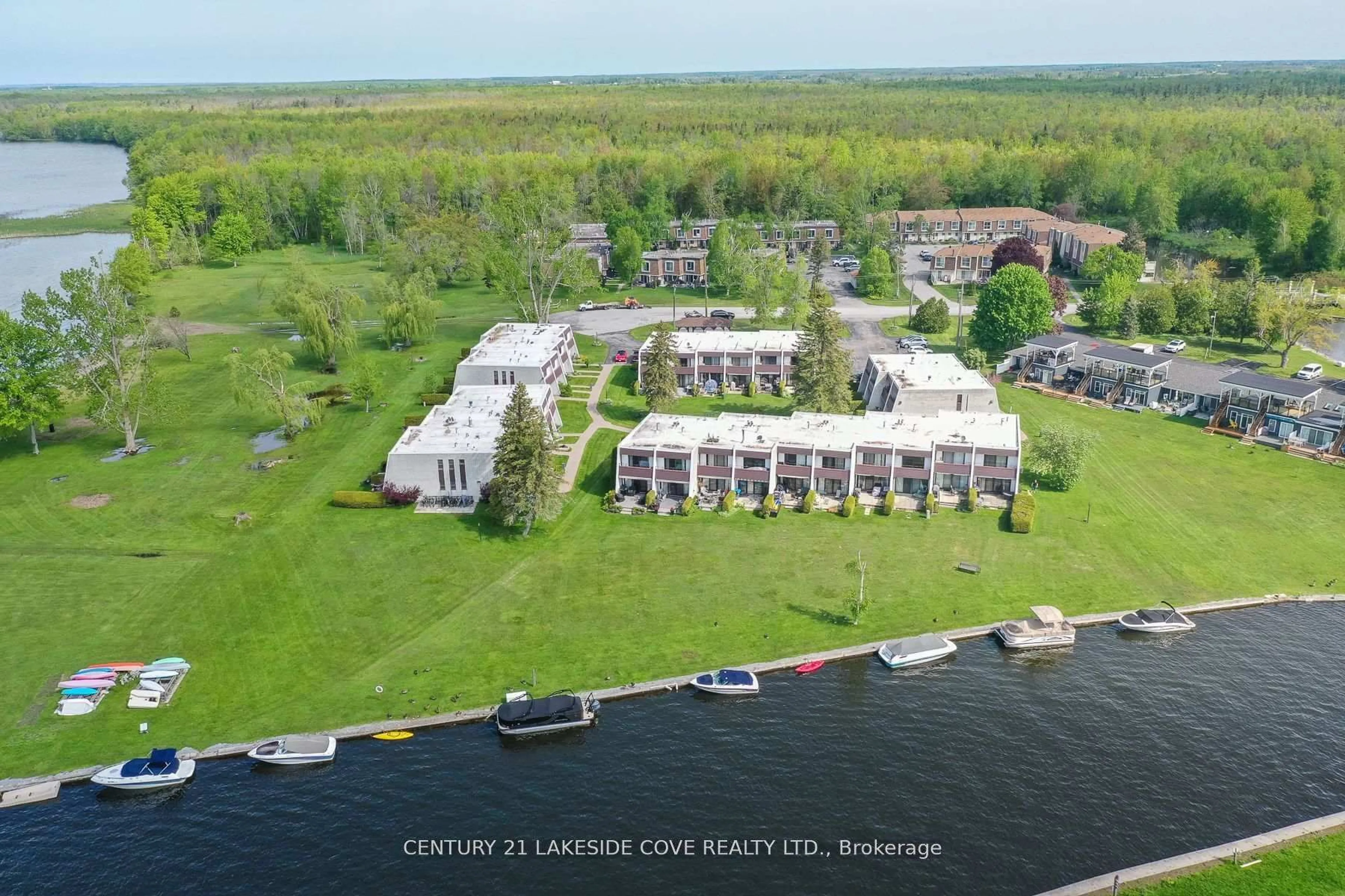A pic from outside/outdoor area/front of a property/back of a property/a pic from drone, water/lake/river/ocean view for 1 Paradise Blvd #Unit 14, Ramara Ontario L0K 1B0