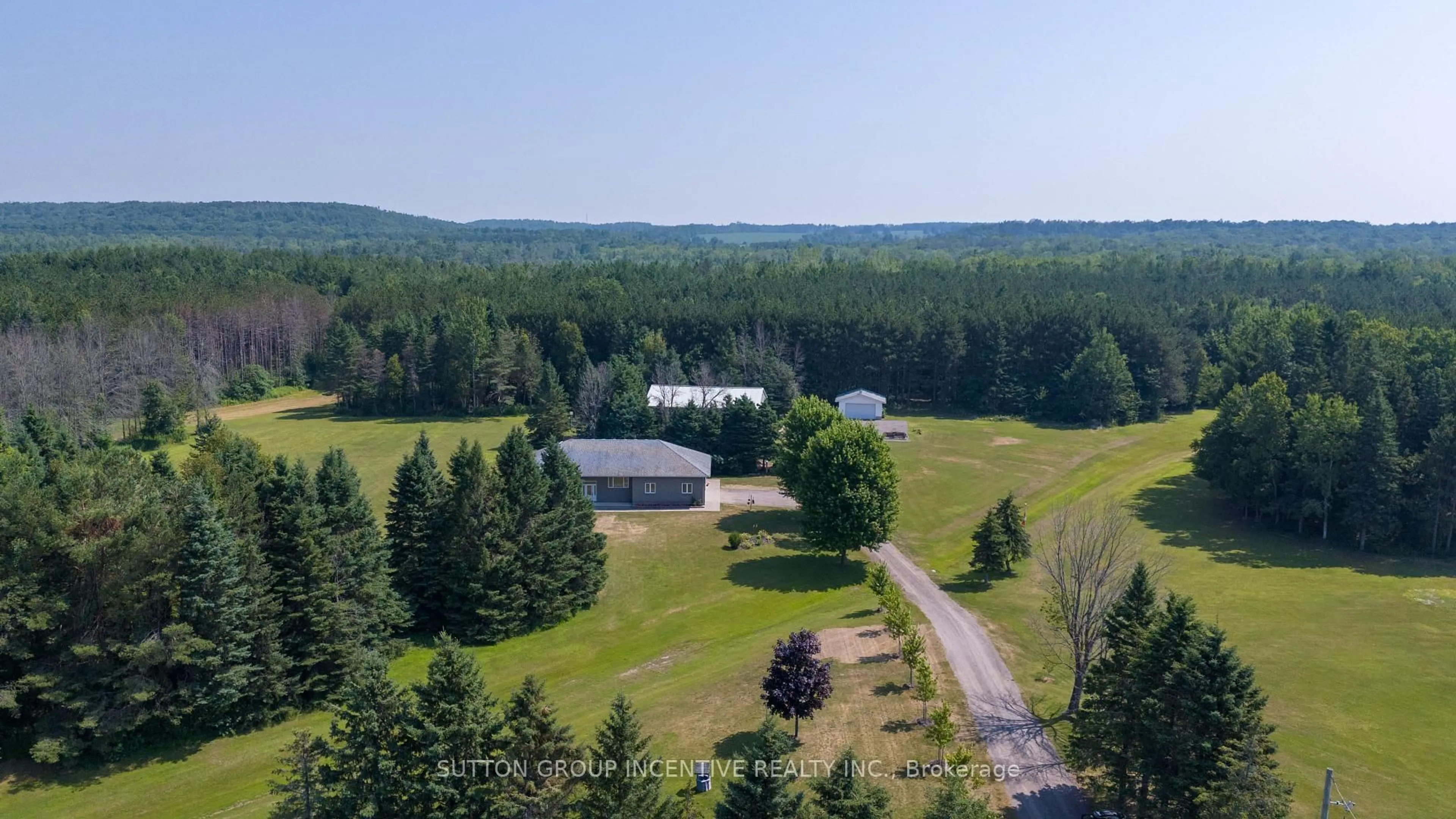 A pic from outside/outdoor area/front of a property/back of a property/a pic from drone, forest/trees view for 13895 County Rd 27 Rd, Springwater Ontario L0L 2K0