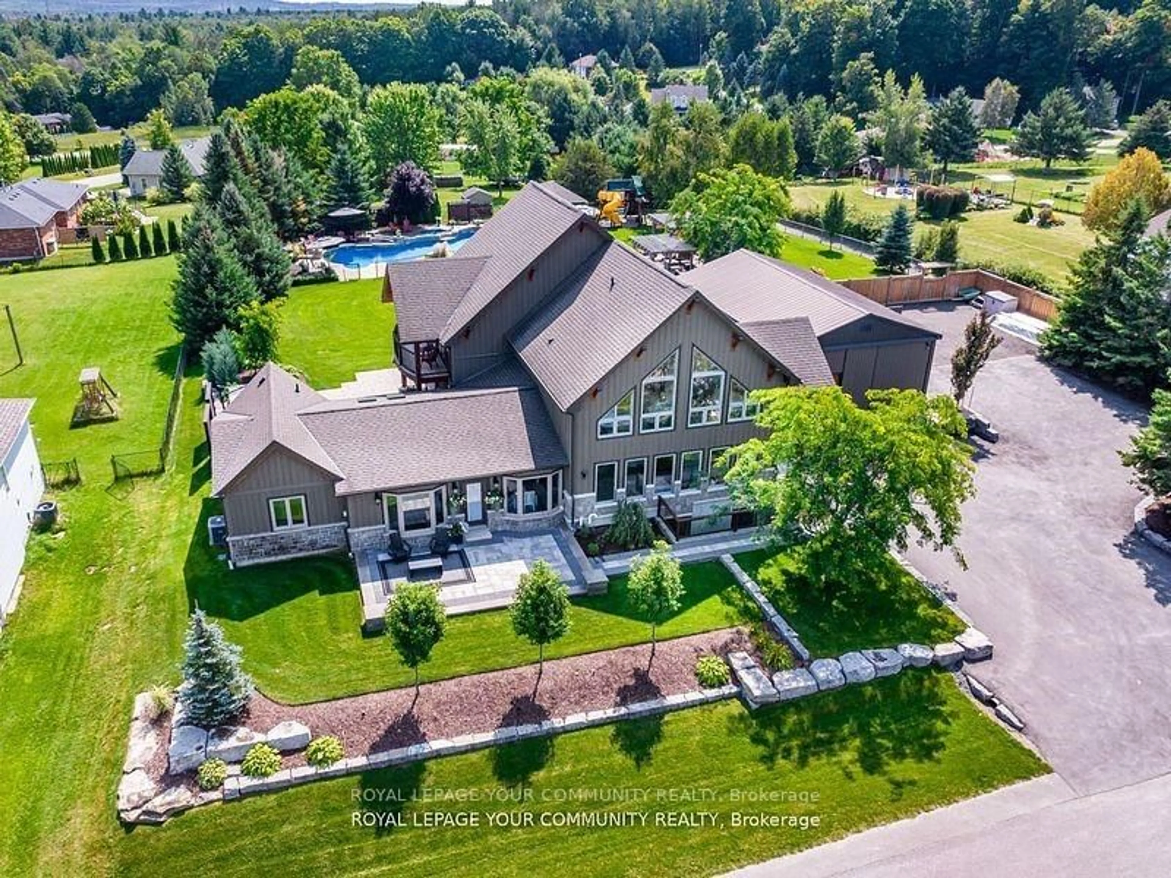 A pic from outside/outdoor area/front of a property/back of a property/a pic from drone, mountain view for 58 Marlow Circ, Springwater Ontario L0L 1V0