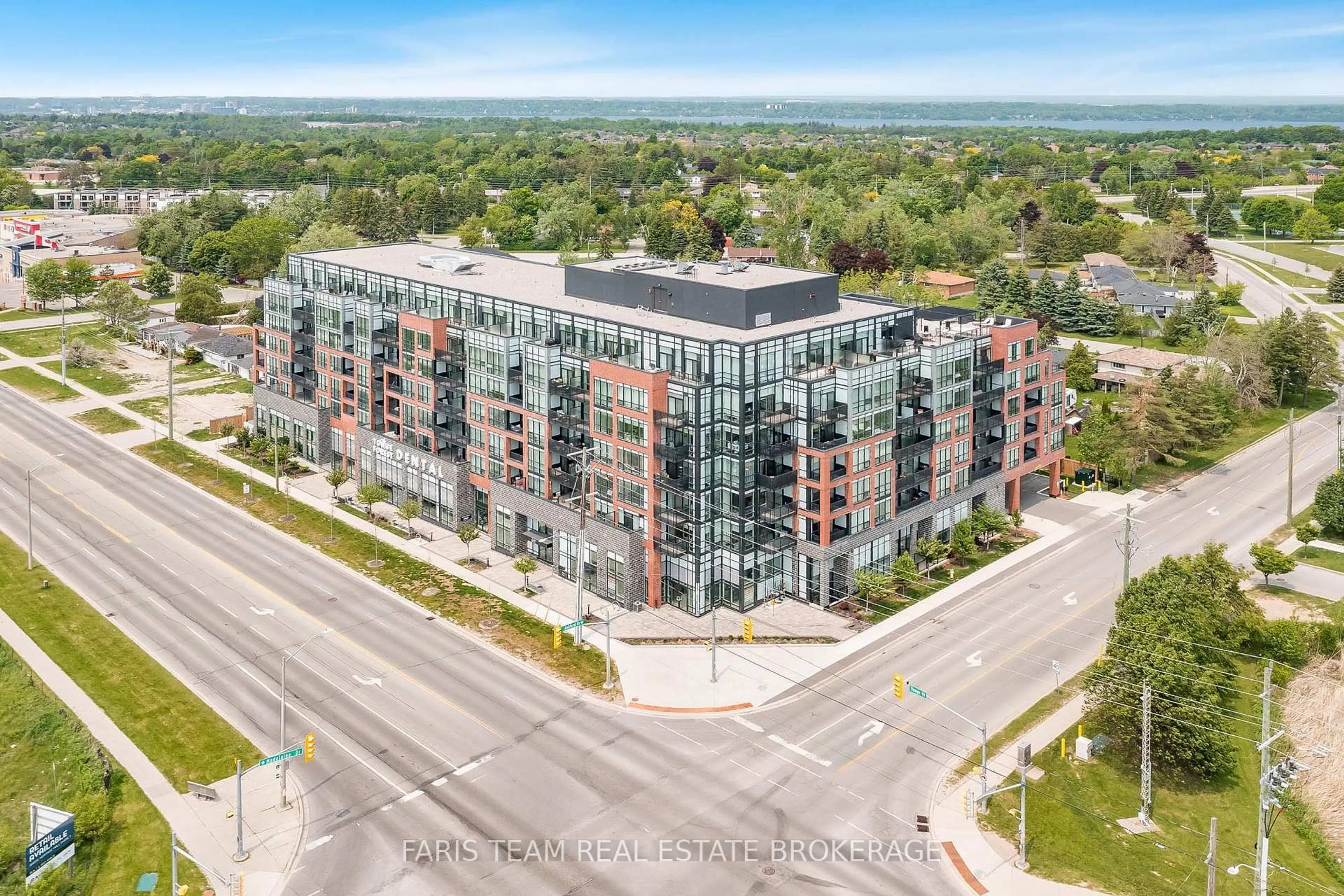 A pic from outside/outdoor area/front of a property/back of a property/a pic from drone, unknown for 681 Yonge St #311, Barrie Ontario L4N 4E8