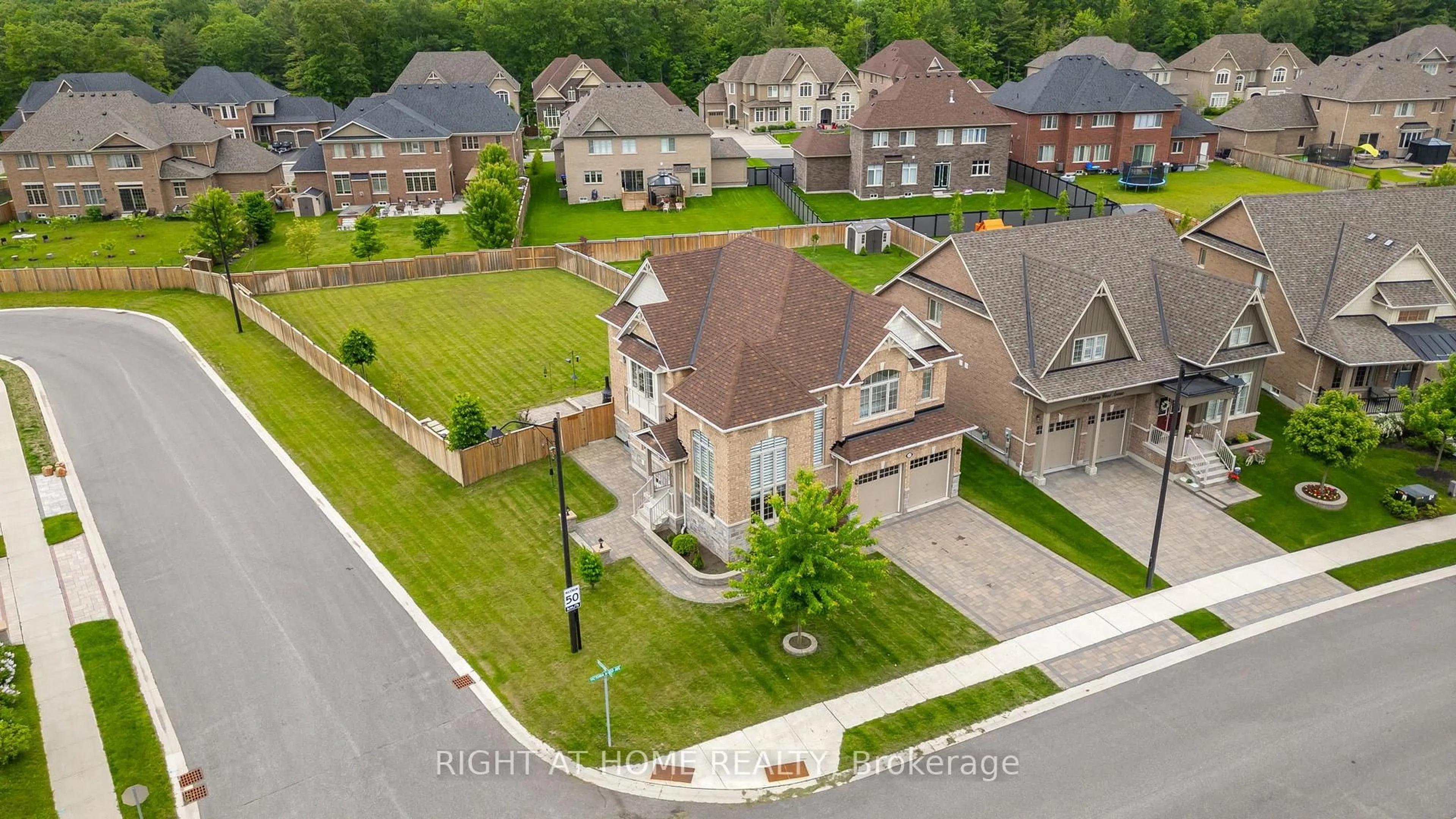 A pic from outside/outdoor area/front of a property/back of a property/a pic from drone, street for 57 Victoria Wood Ave, Springwater Ontario L9X 1Z8