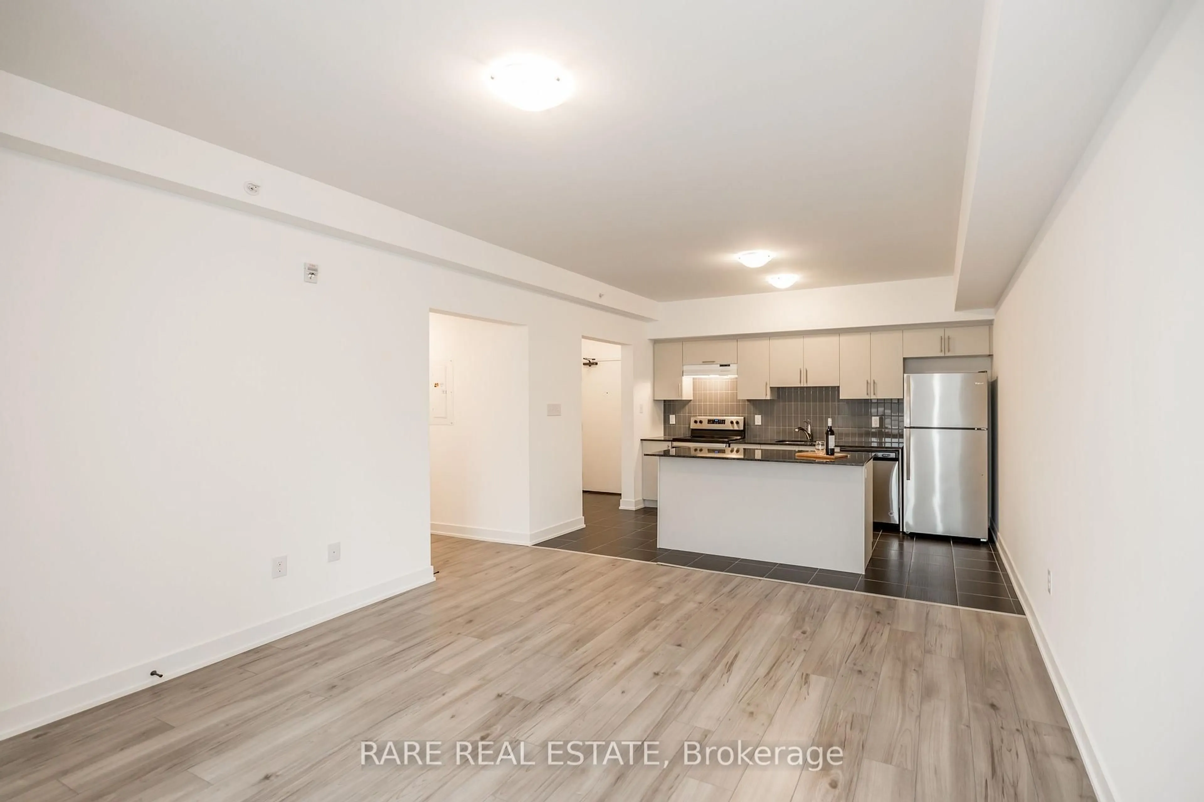 Open concept kitchen, wood/laminate floor for 6 Spice Way #106, Barrie Ontario L9J 0J9