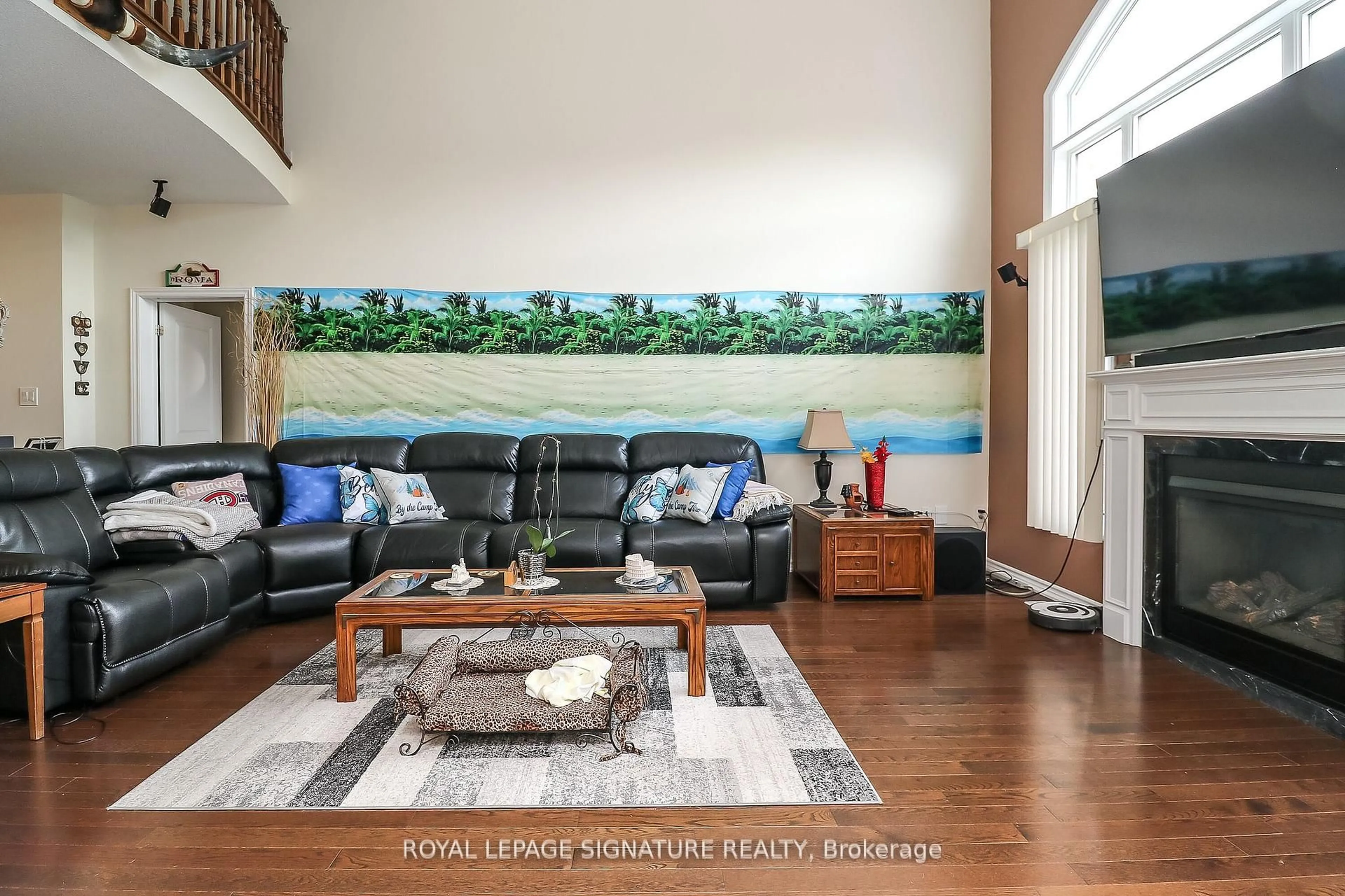 Living room with furniture, wood/laminate floor for 48 Allegra Dr, Wasaga Beach Ontario L9Z 0H1