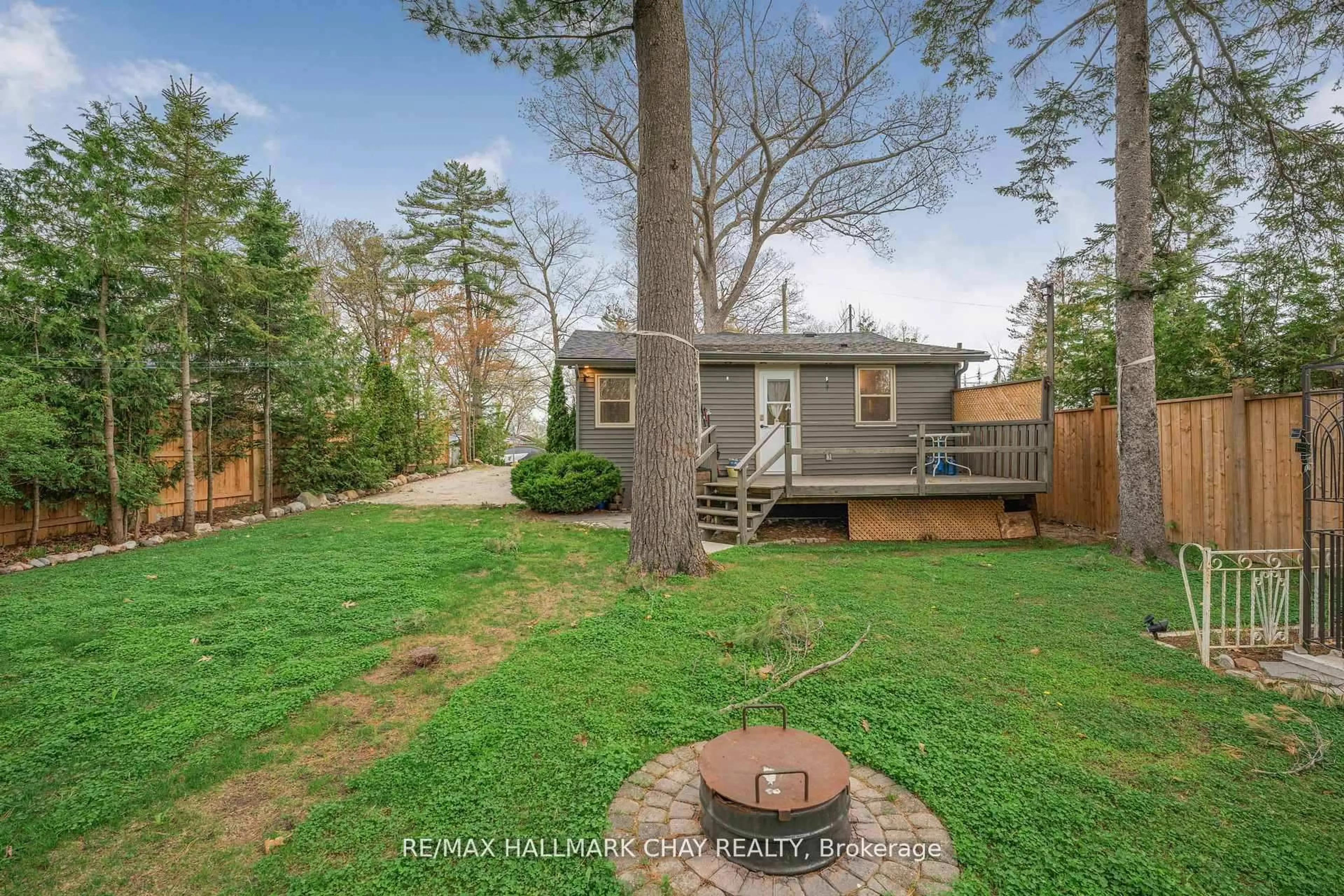 A pic from outside/outdoor area/front of a property/back of a property/a pic from drone, forest/trees view for 57 Laidlaw St, Wasaga Beach Ontario L9Z 2L2