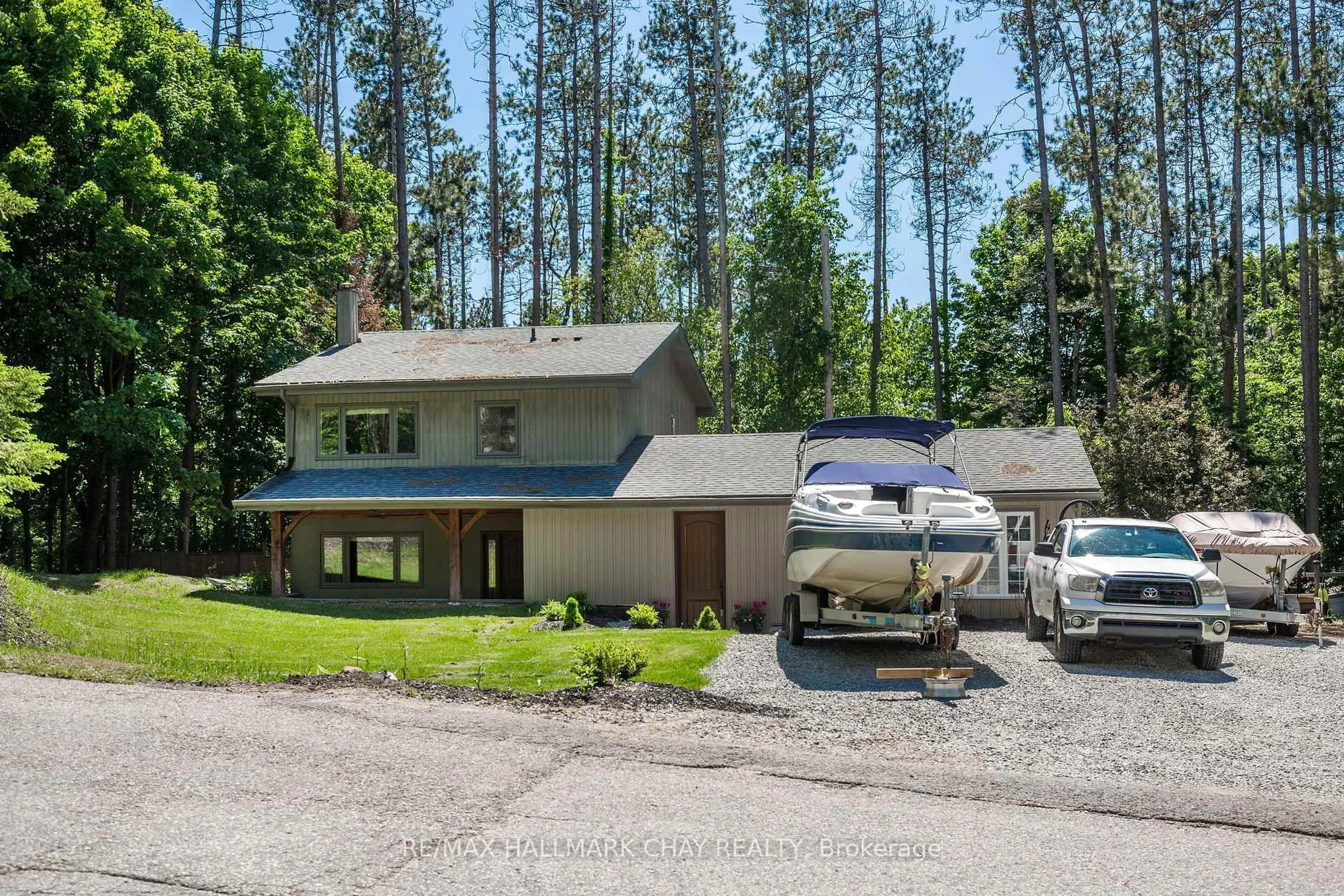 A pic from outside/outdoor area/front of a property/back of a property/a pic from drone, forest/trees view for 1 Pine Spring, Oro-Medonte Ontario L4M 4Y8