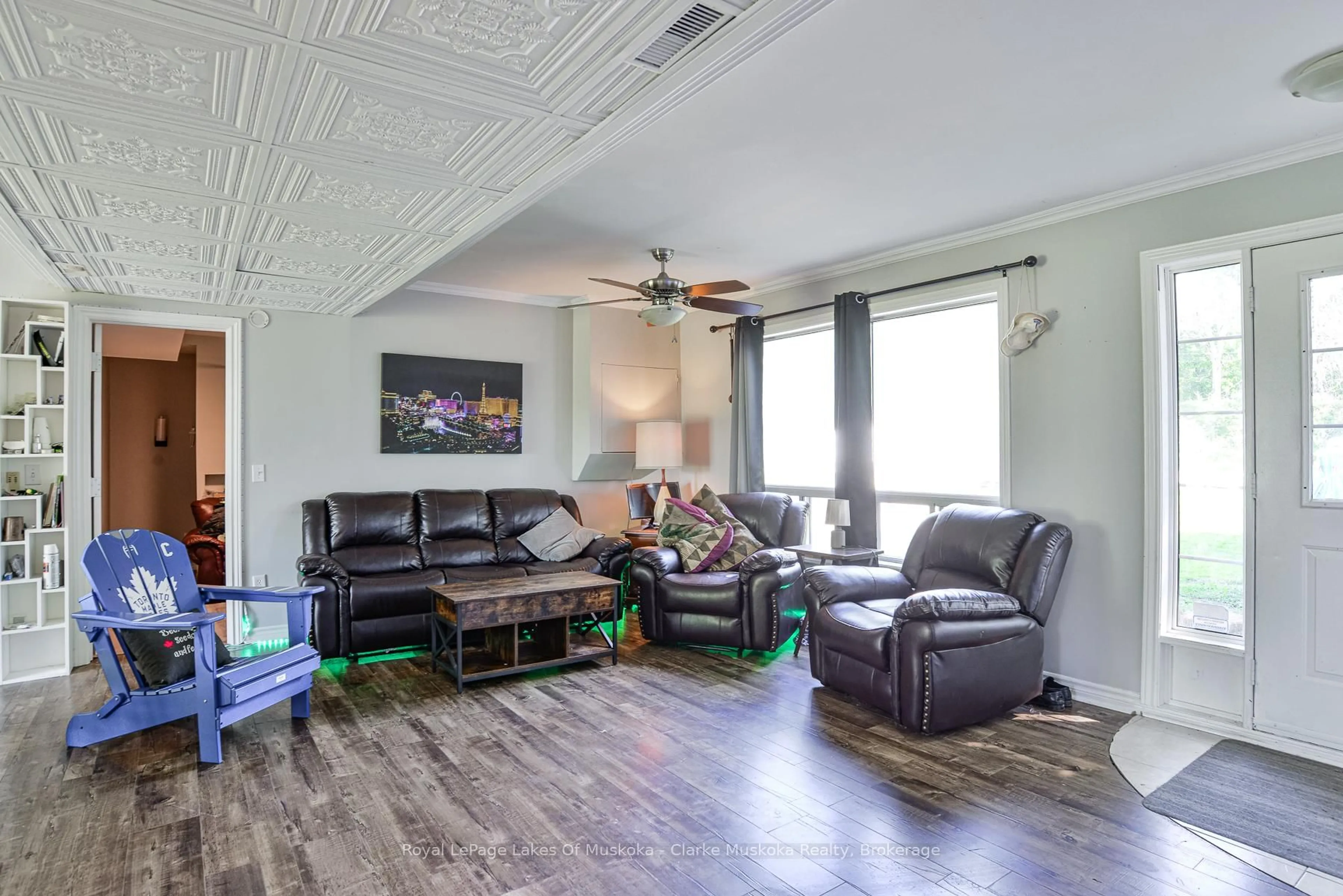 Living room with furniture, wood/laminate floor for 1628 TRADER COWAN Rd, Severn Ontario L0K 1E0