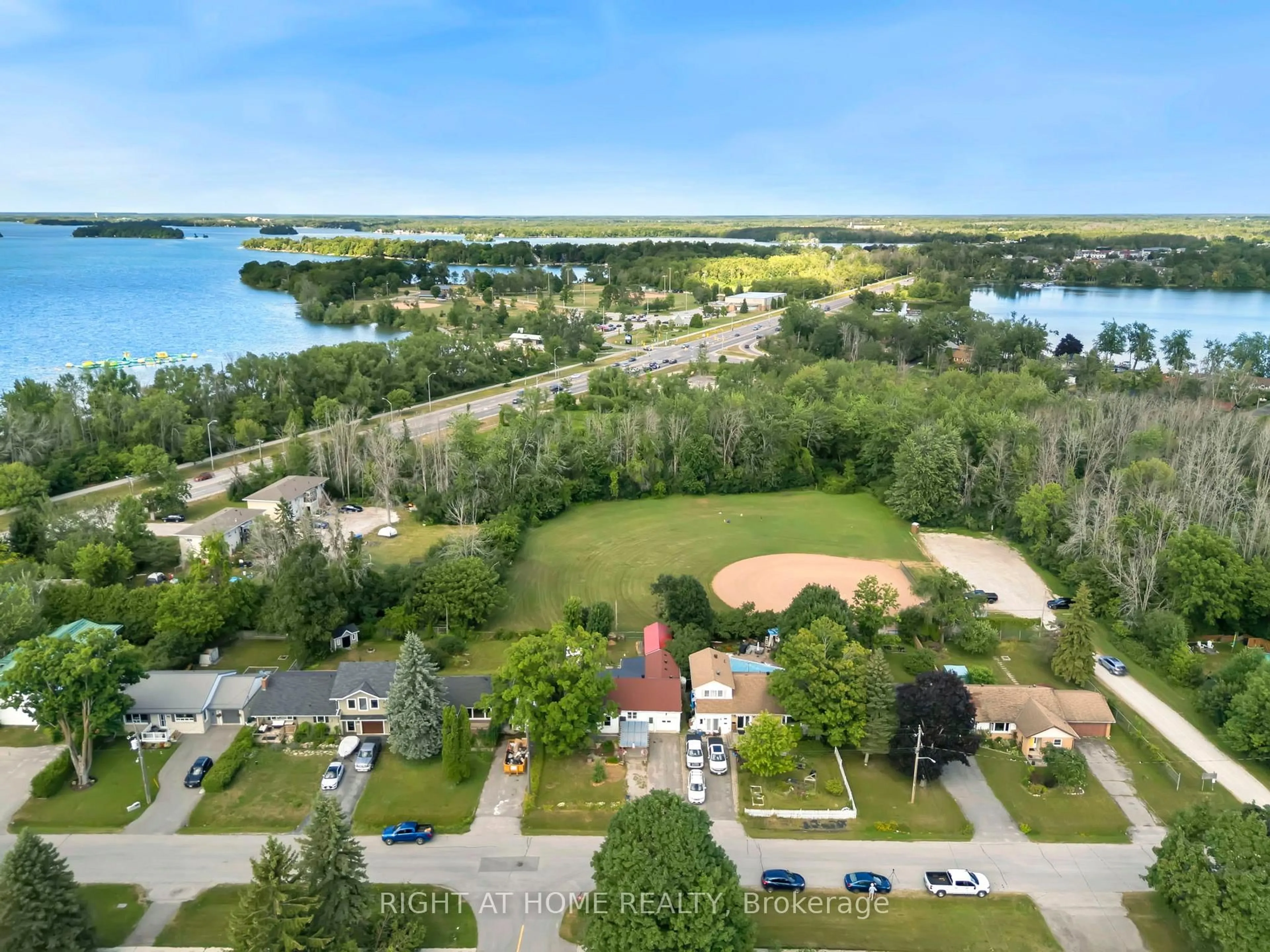 A pic from outside/outdoor area/front of a property/back of a property/a pic from drone, water/lake/river/ocean view for 392 Bayview Pkwy, Orillia Ontario L3V 3Y2