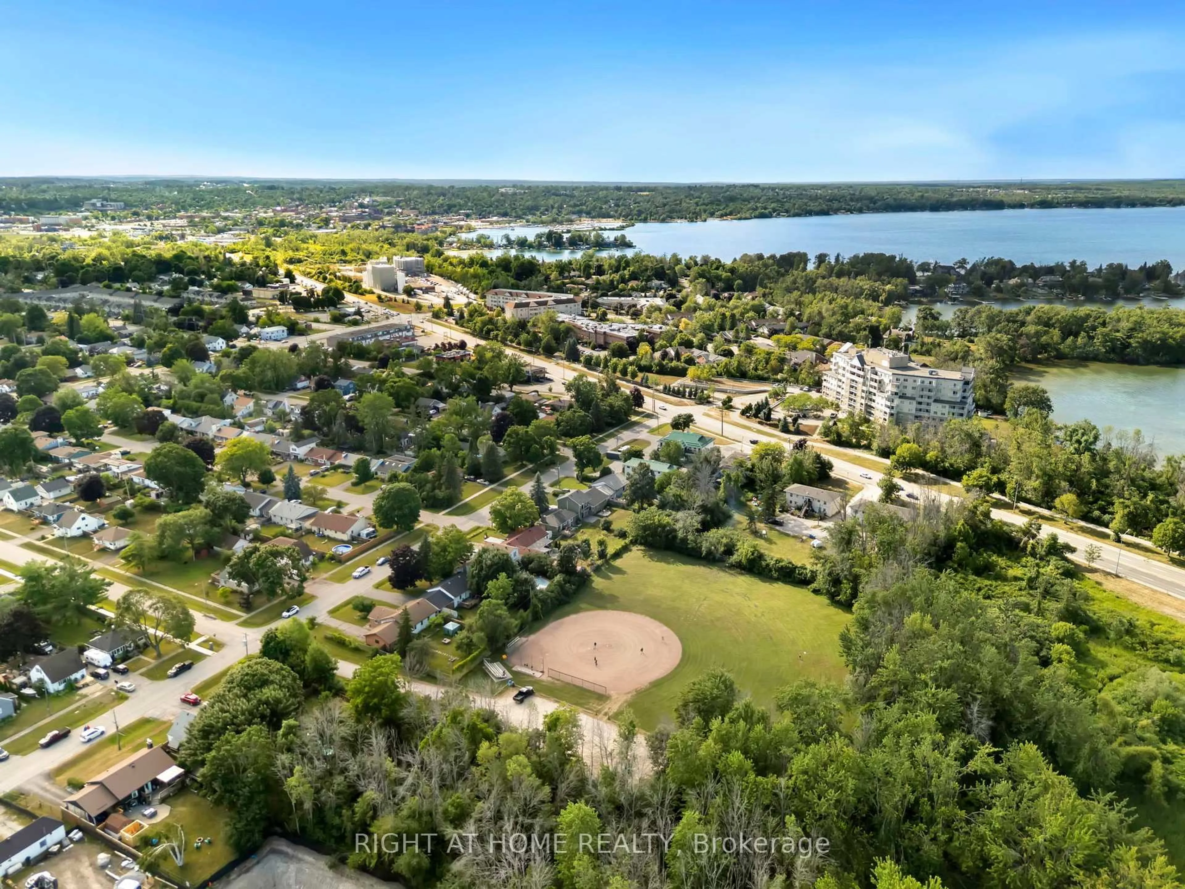 A pic from outside/outdoor area/front of a property/back of a property/a pic from drone, water/lake/river/ocean view for 392 Bayview Pkwy, Orillia Ontario L3V 3Y2